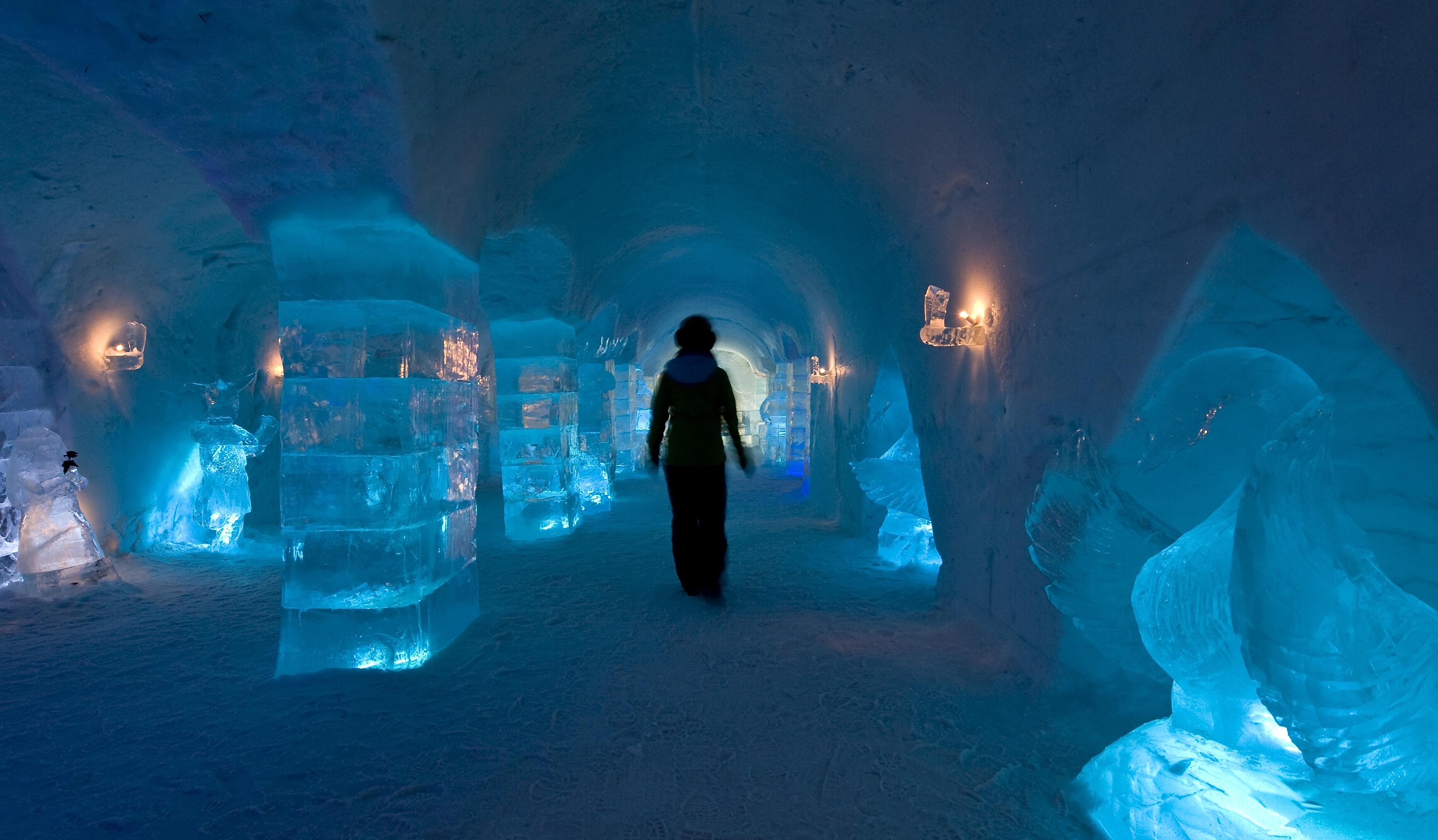 Person inside Sorrisniva Igloo Hotel, in Alta