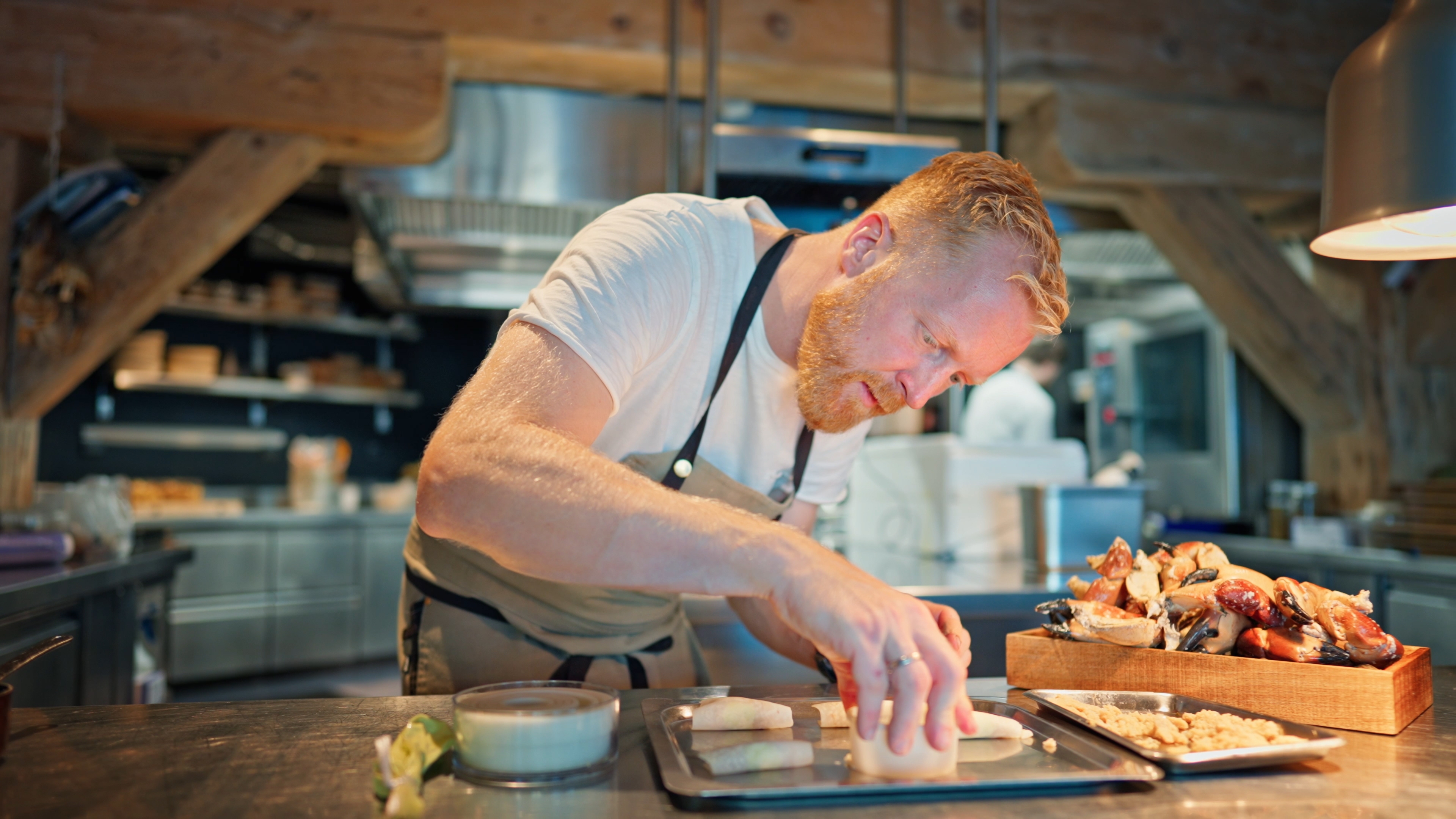 Chef plating food at Restaurant Bro & Bryt in Ålesund