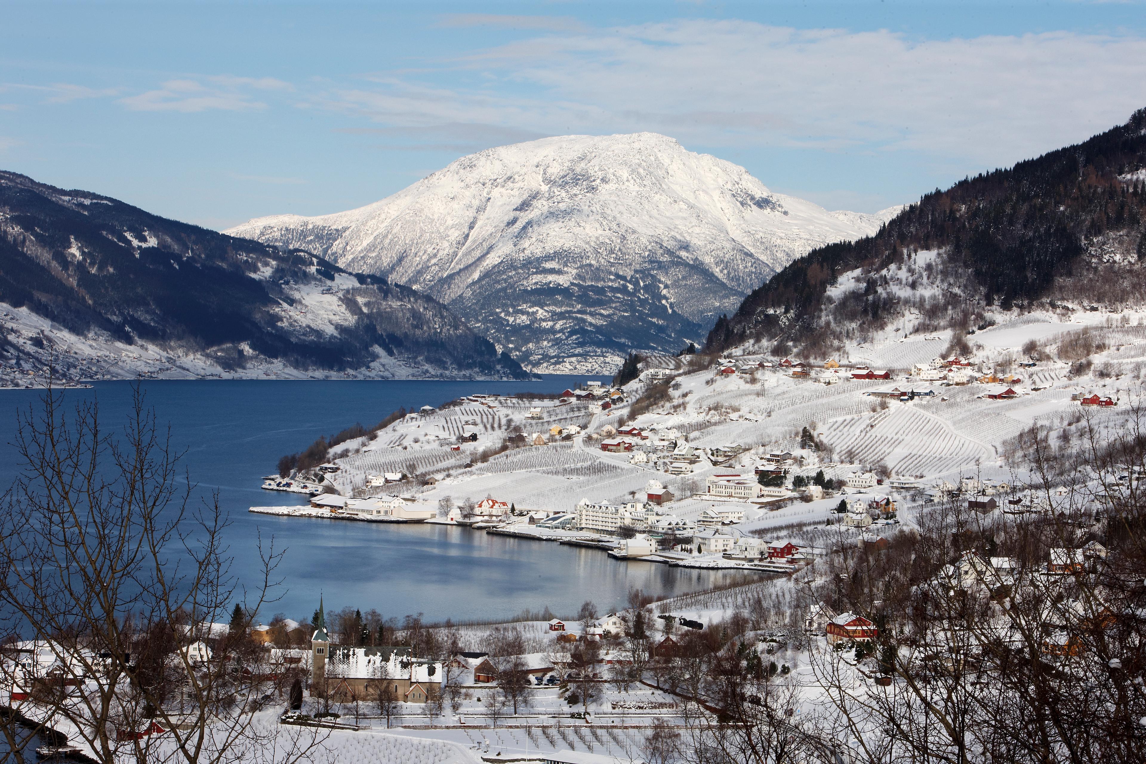 The charming village Lufthus by the Hardangerfjord in Fjord Norway, covered in snow.