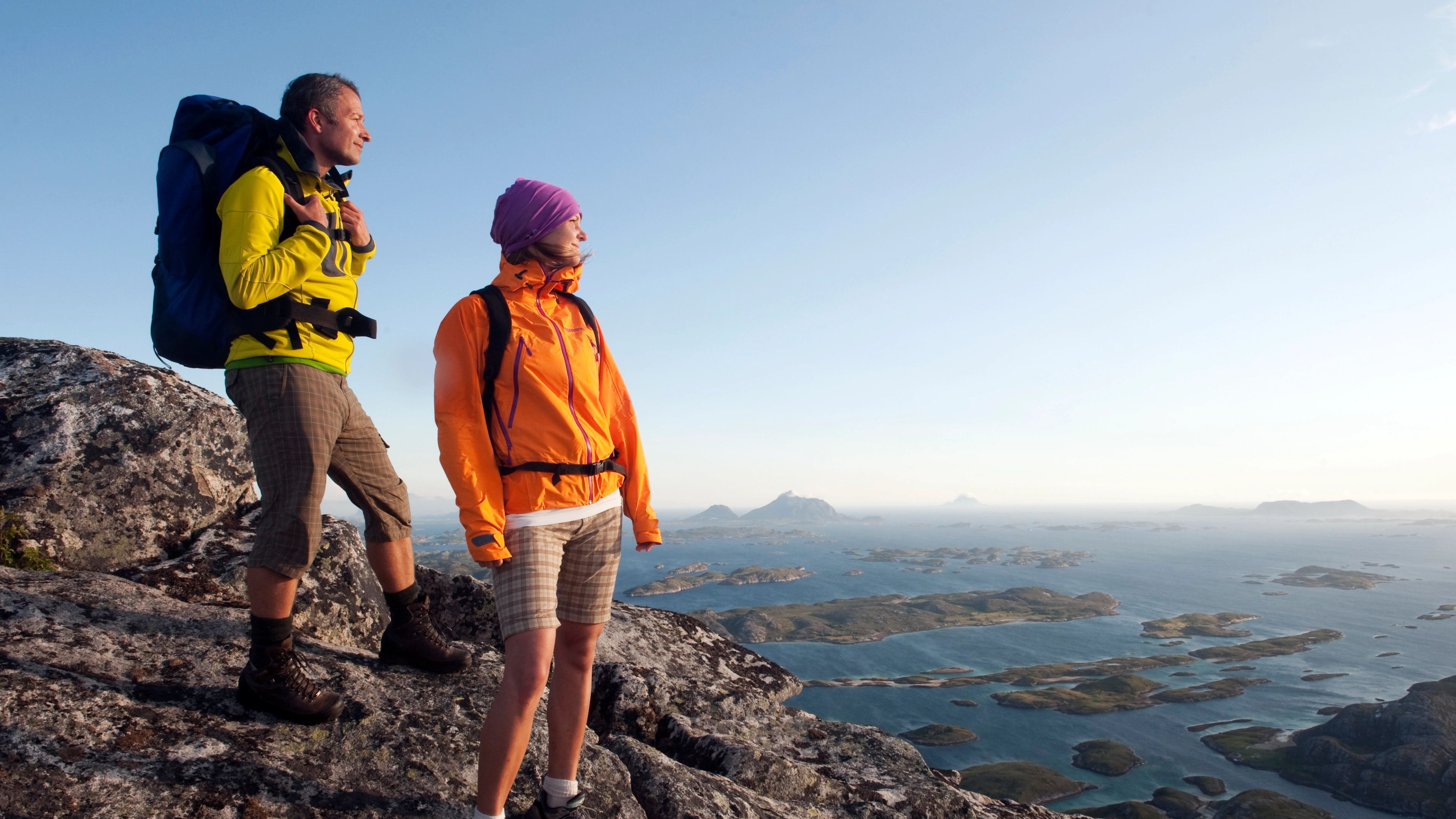 Two people hiking in the mountains at the Helgeland coast in Northern Norway