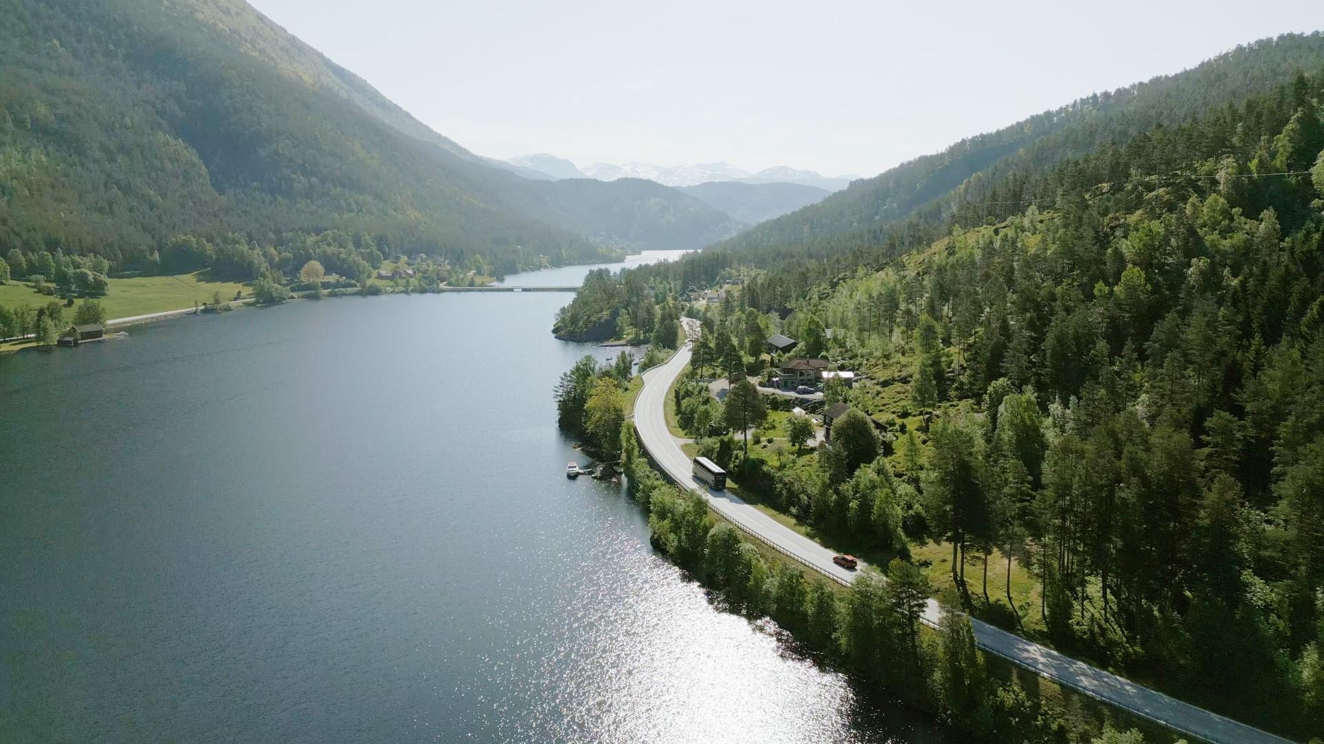 A bus driving along a fjord in Norway, Vy express route vy146