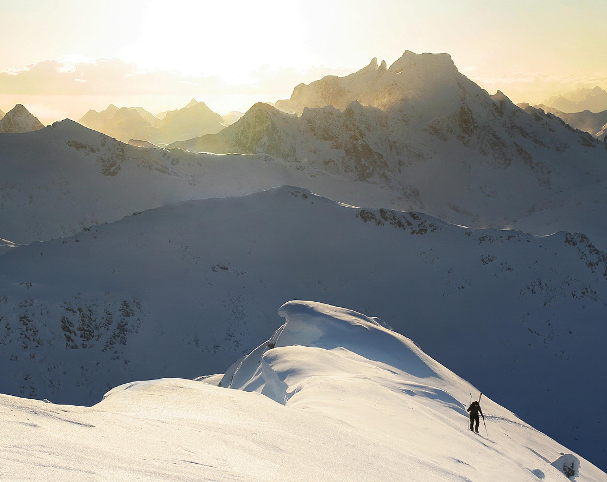 A person ski touring on a mountain in Northern Norway