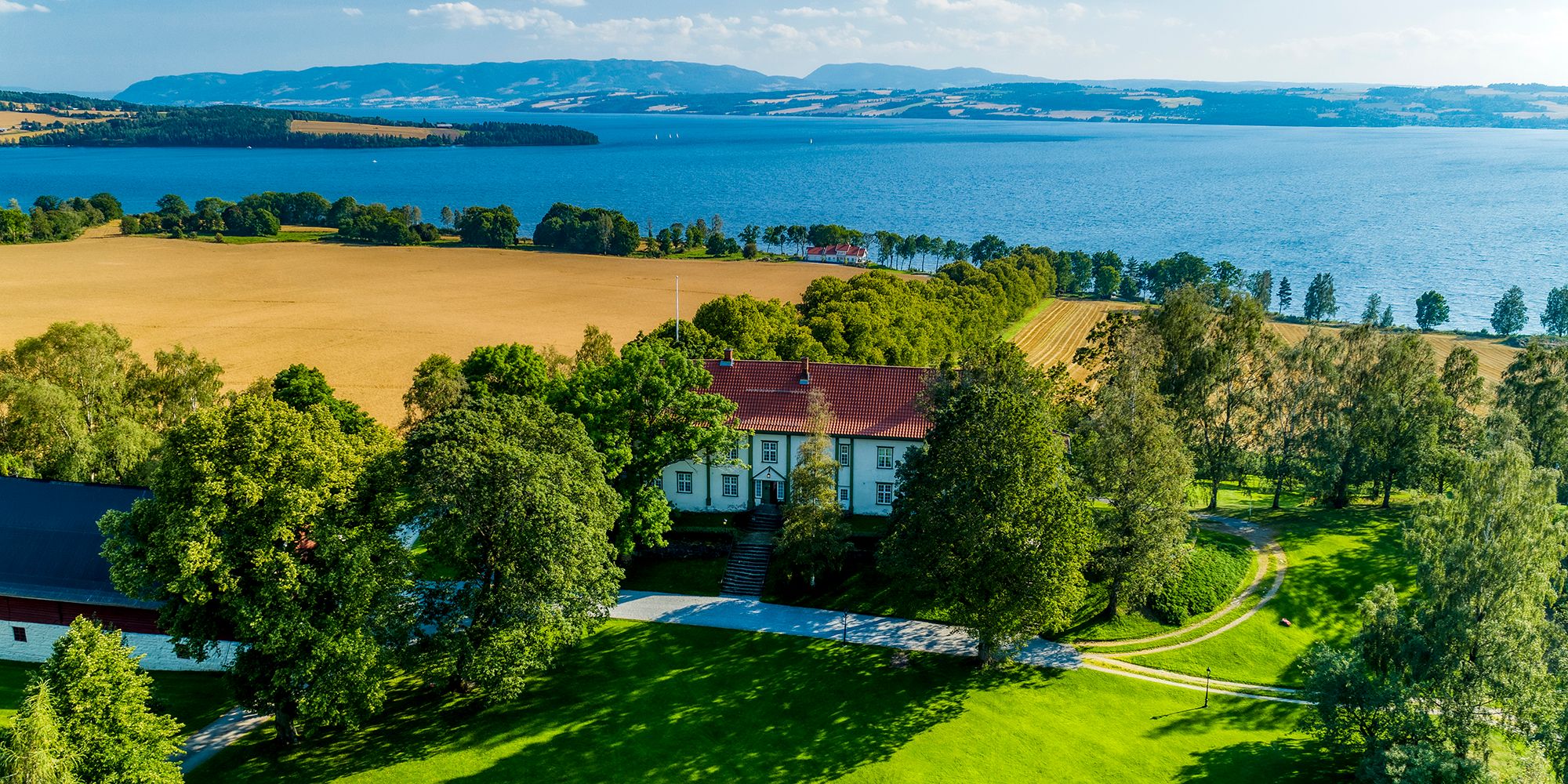 Summer at the farm Hoel Gård on the Nes peninsula, right by lake Mjøsa in Ringsaker, Eastern Norway