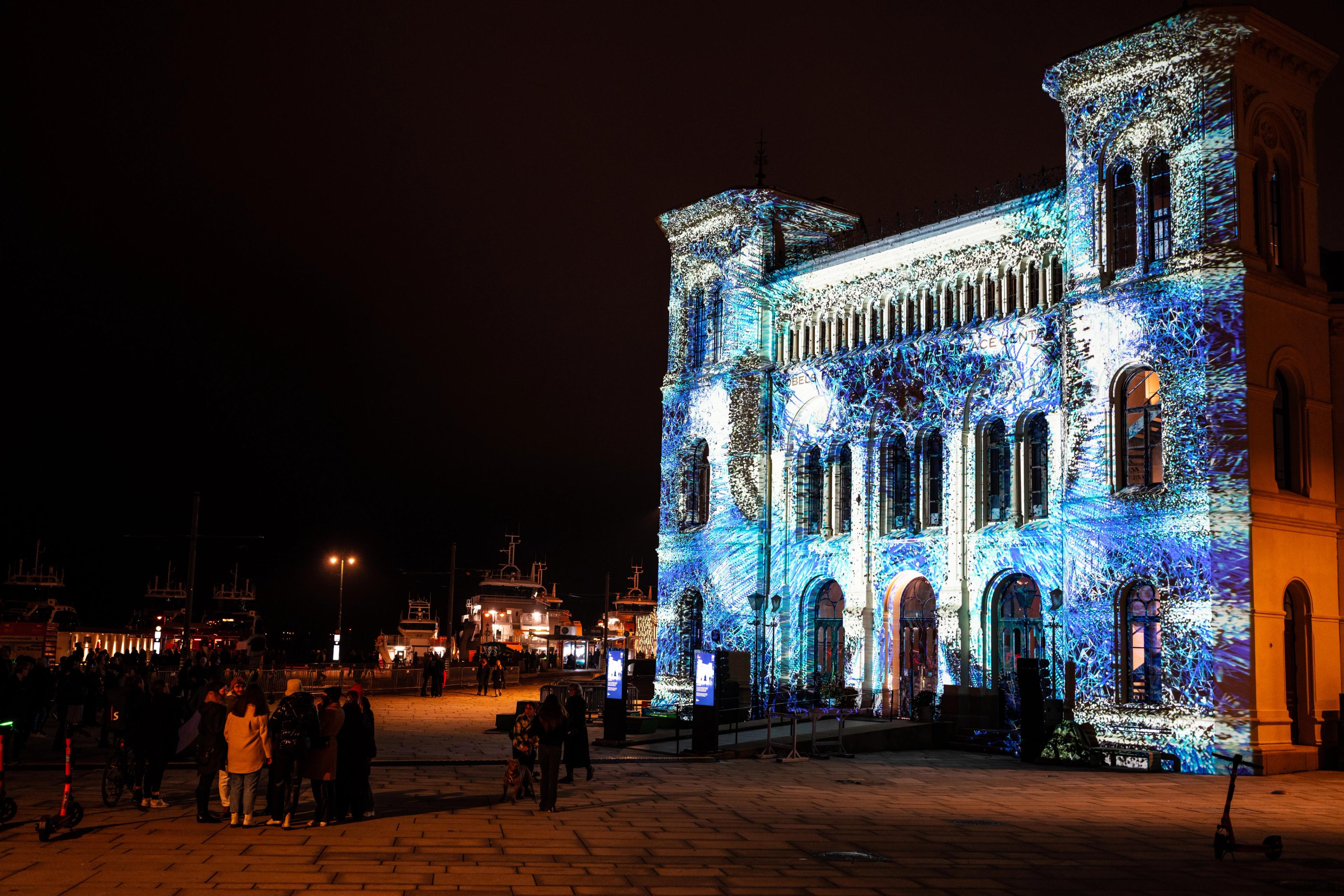 The Nobel peace center lit up in light art at FjordOslo light art festival 2022 in Oslo