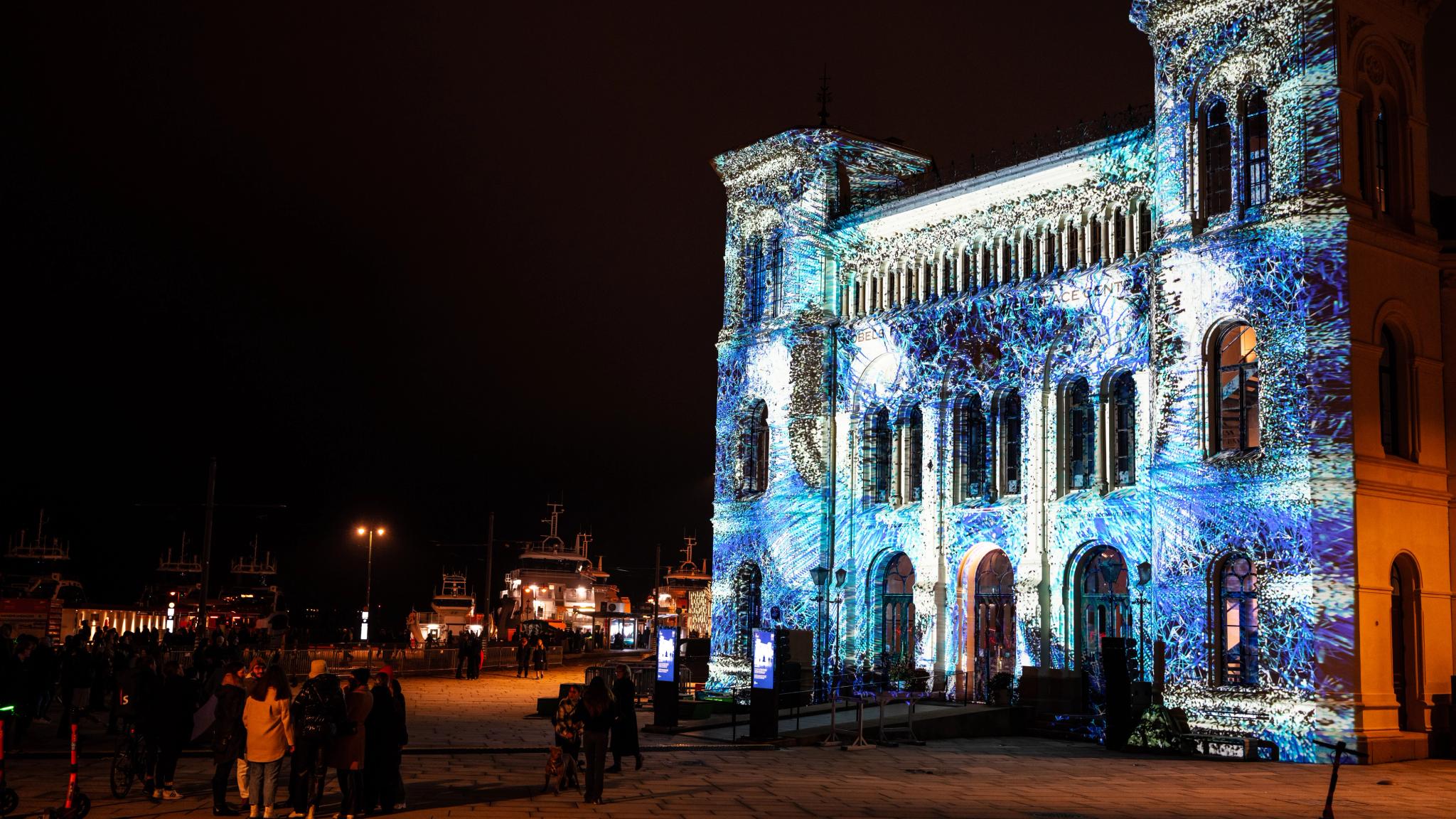 The Nobel peace center lit up in light art at FjordOslo light art festival 2022 in Oslo