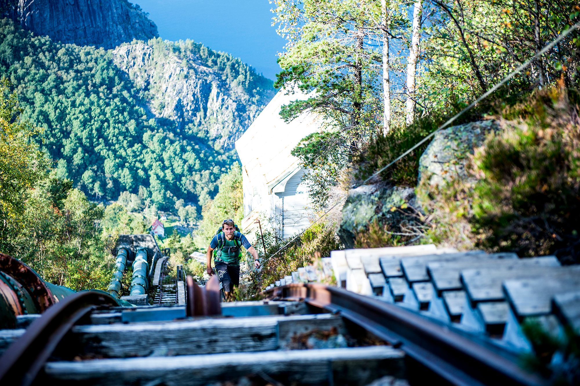 Person hiking the Flørlitrappene strais by the Lysefjord in Ryfylke, Fjord Norway