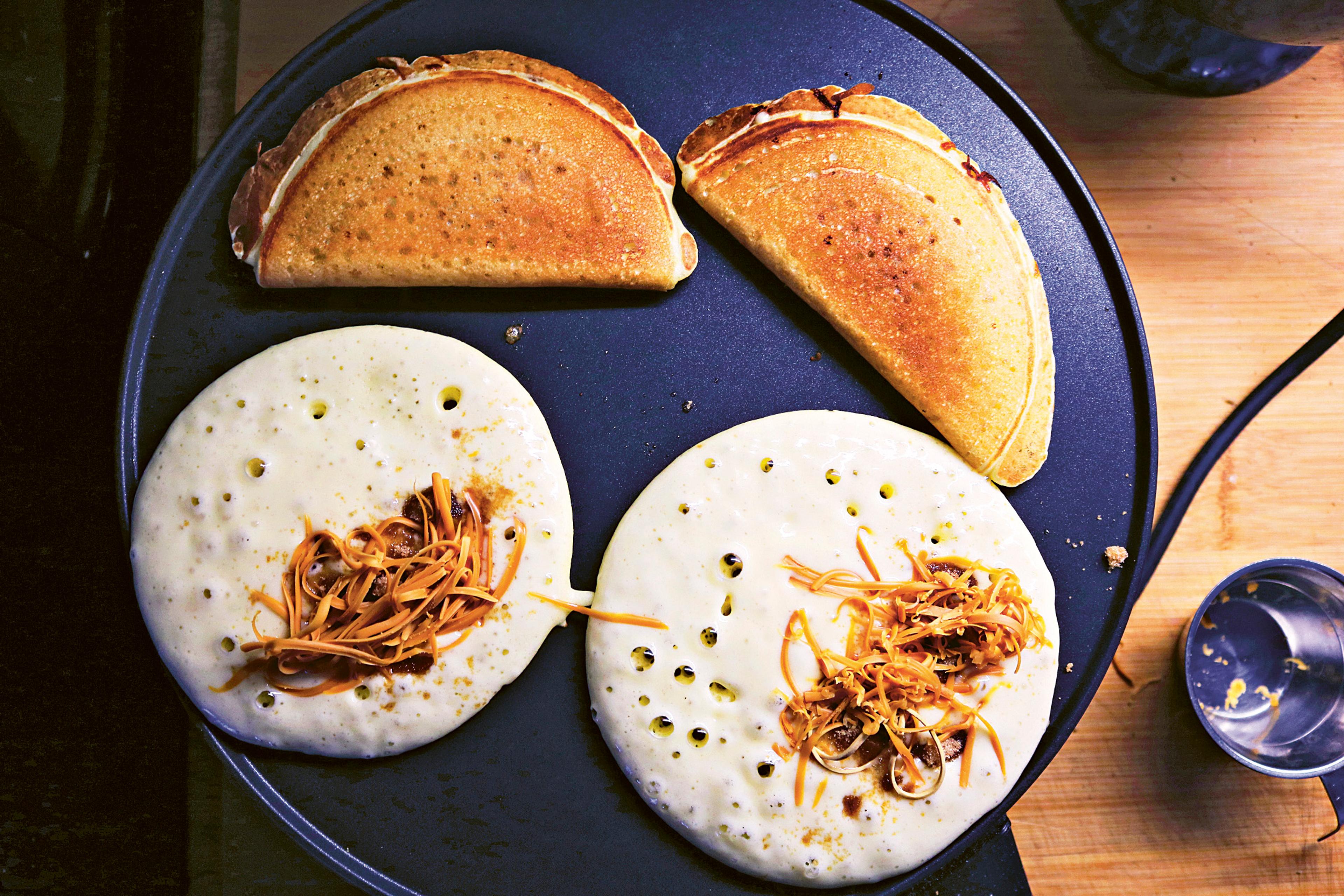 Lefse with melted brunost (brown cheese) served on a platter in Norway