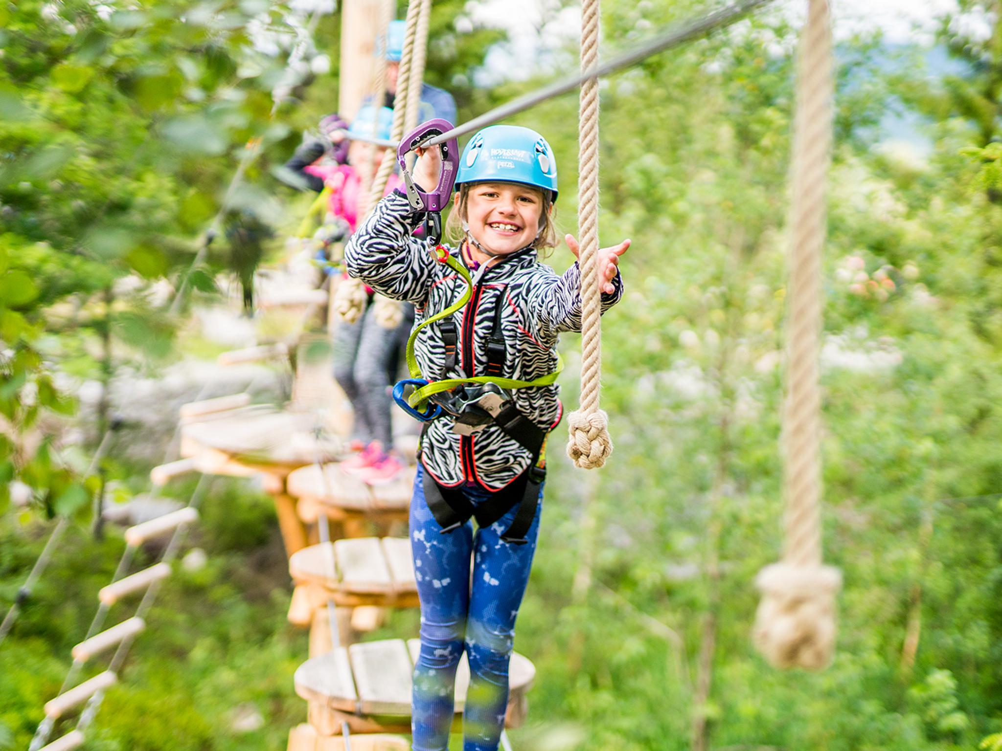 A girl on a family holiday in Trysil, Eastern Norway, in the climbing park Høyt & Lavt