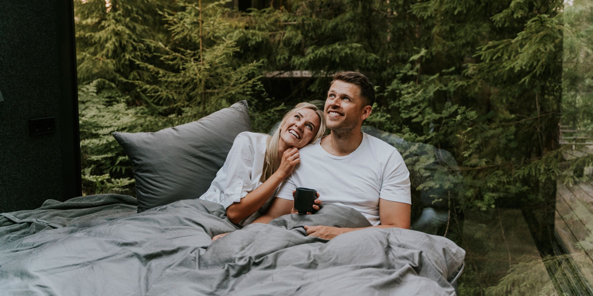 A man and a woman in bed at Laagen in Vestfold in Eastern Norway