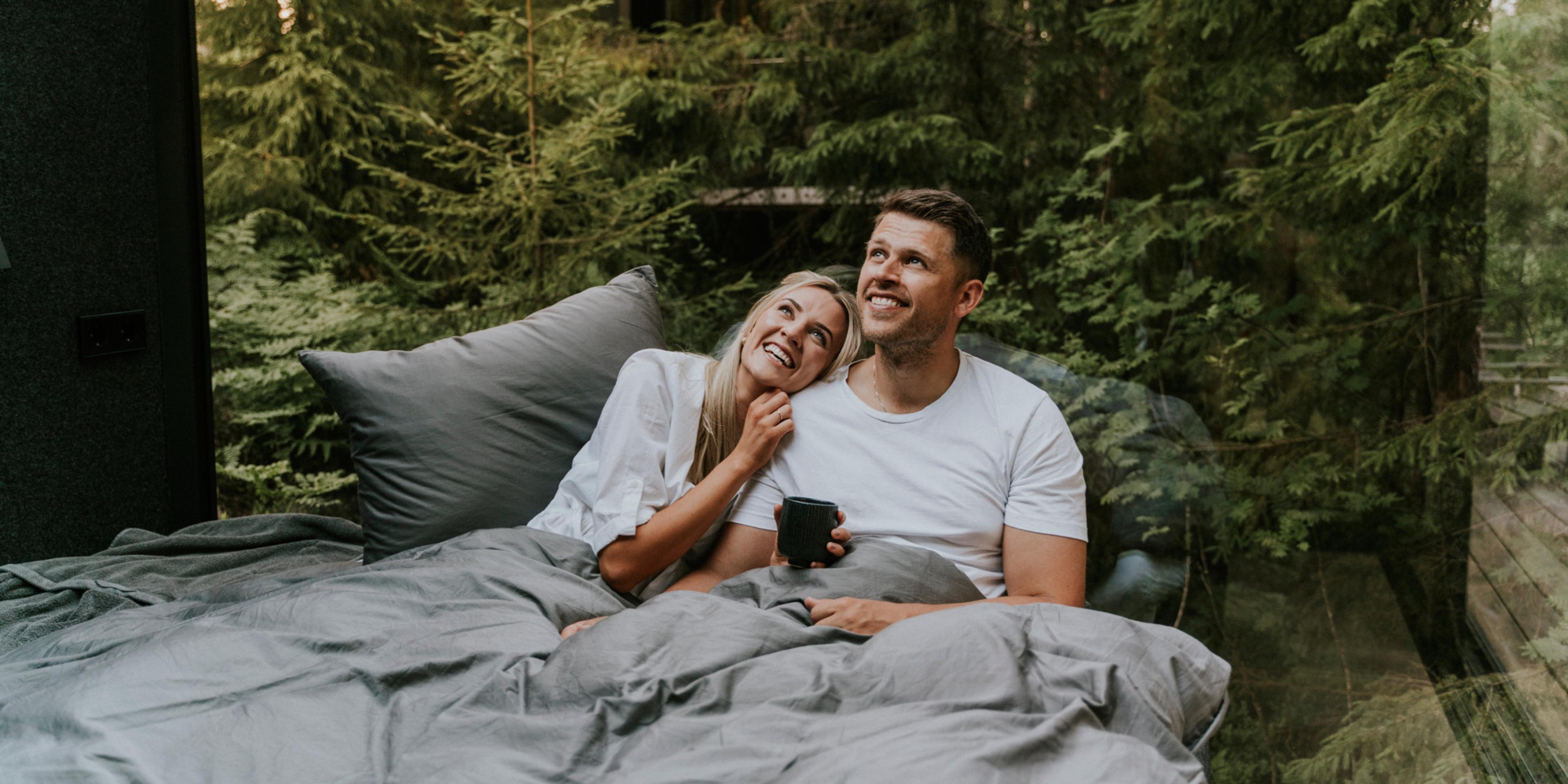 A man and a woman in bed at Laagen in Vestfold in Eastern Norway