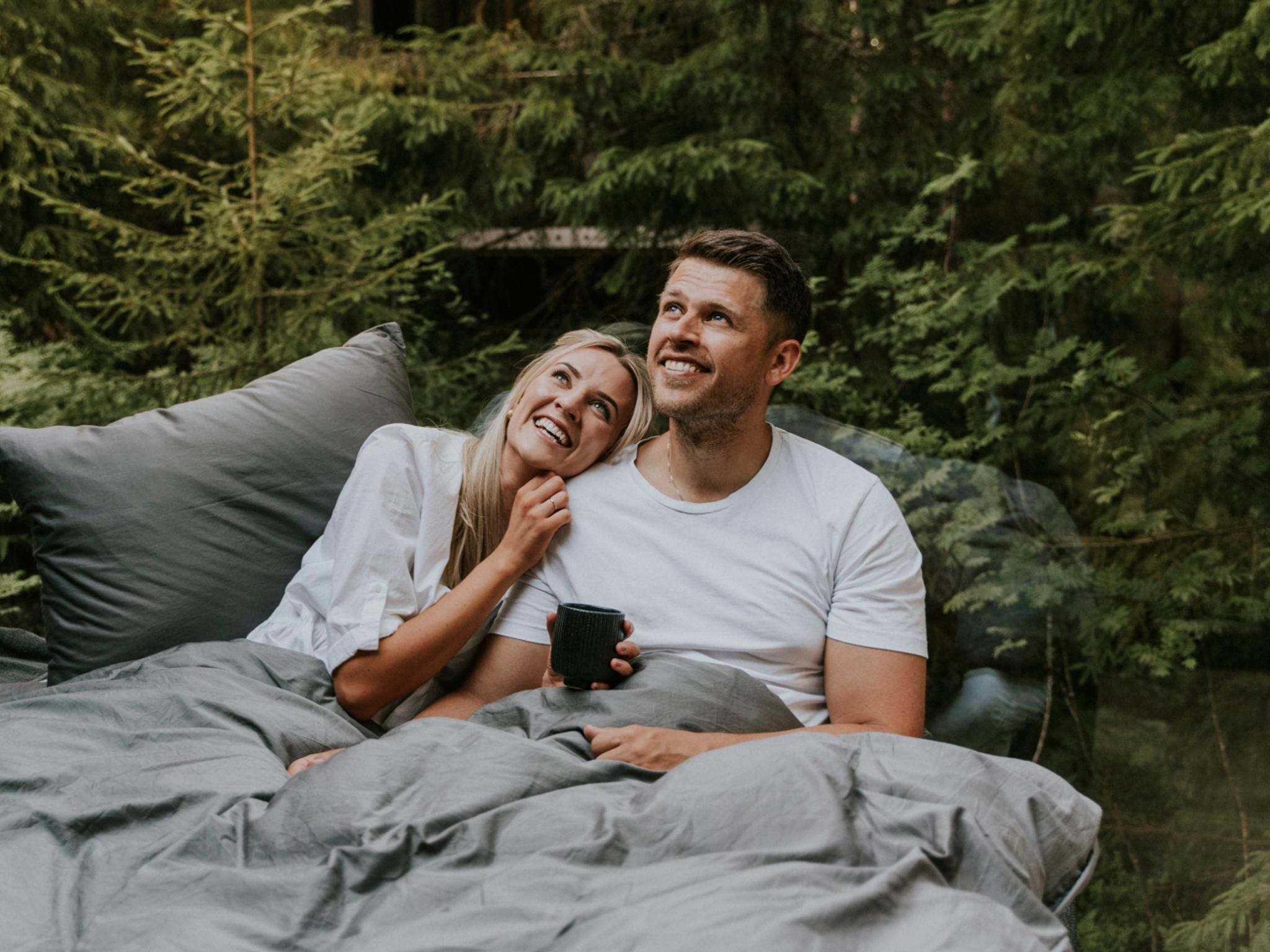 A man and a woman in bed at Laagen in Vestfold in Eastern Norway