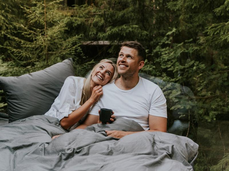 A man and a woman in bed at Laagen in Vestfold in Eastern Norway