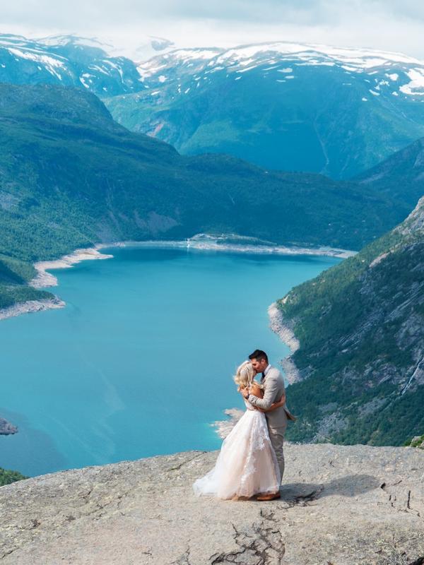 A couple getting married at Trolltunga in Ullensvang in Fjord Norway