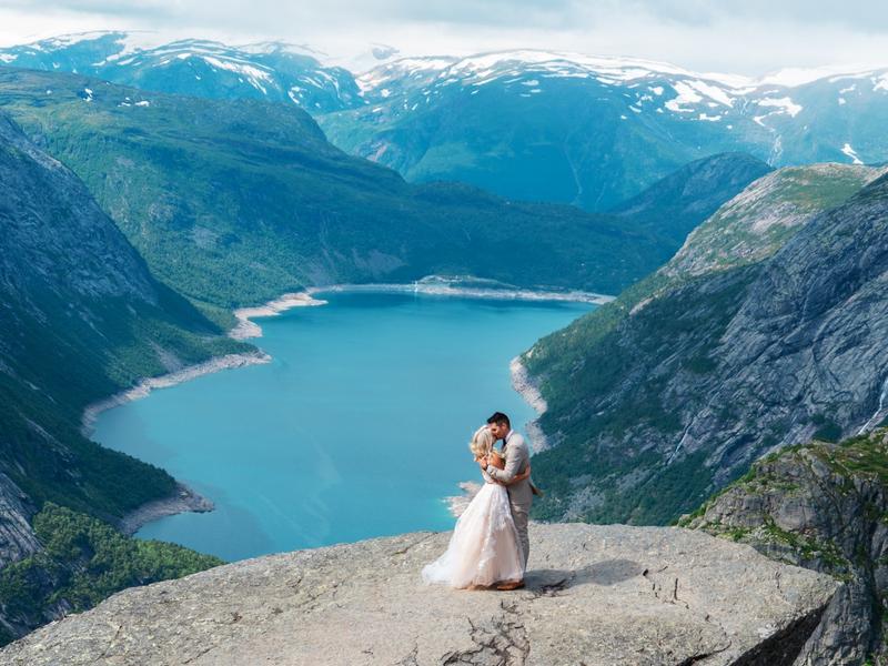 A couple getting married at Trolltunga in Ullensvang in Fjord Norway