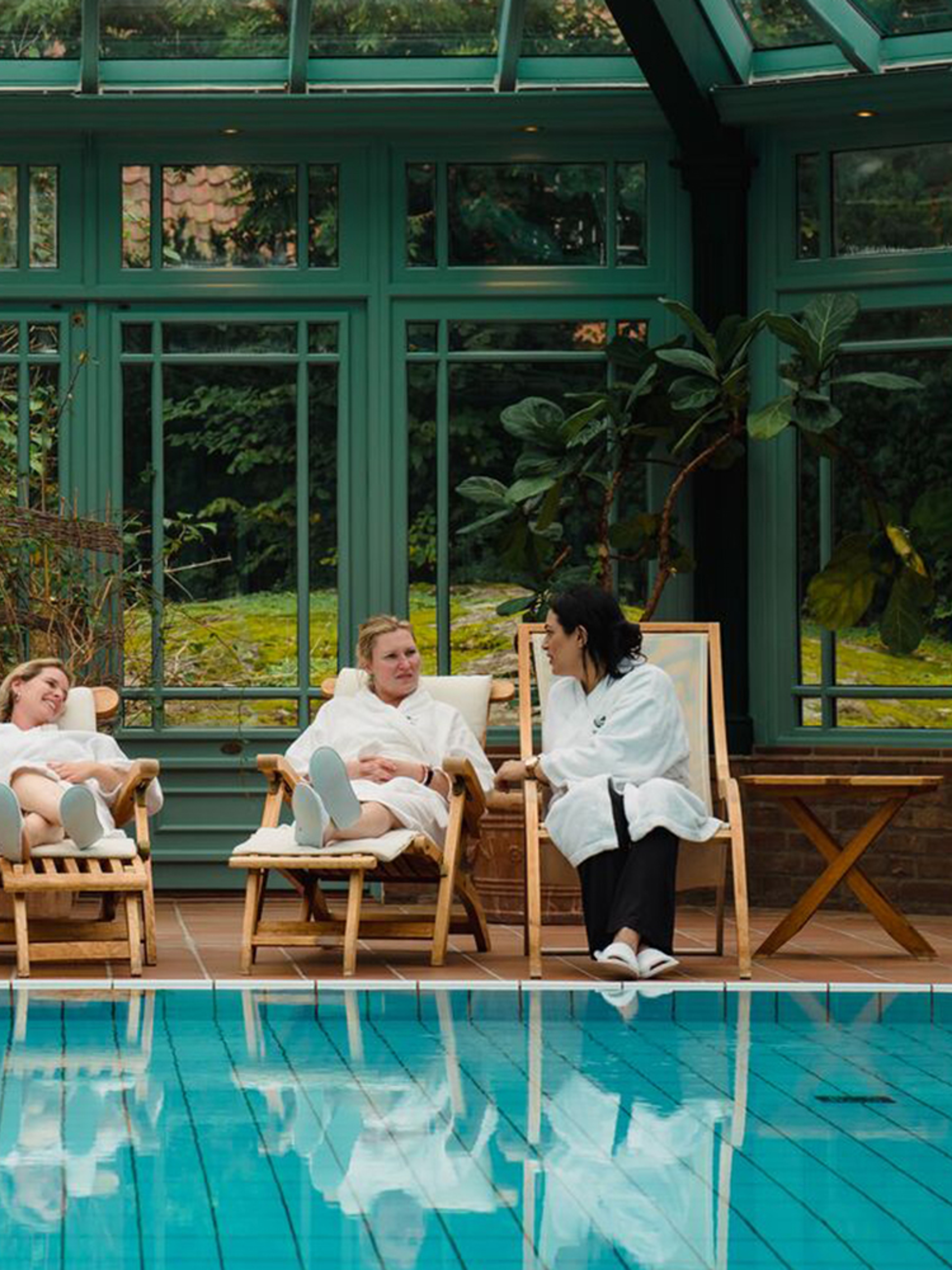 Four women relaxing by the indoor pool at Engø gård at Tjøme, Eastern Norway