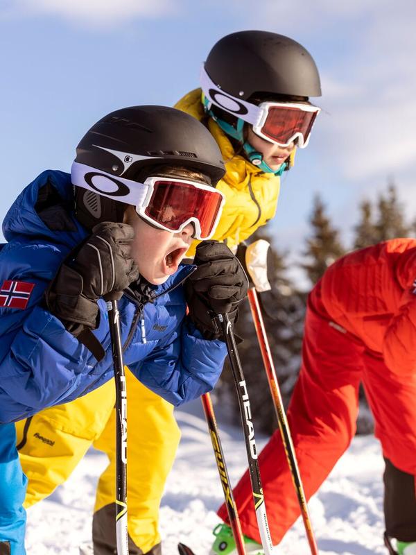Three alpine skiing kids ready for action in the slopes of Hafjell