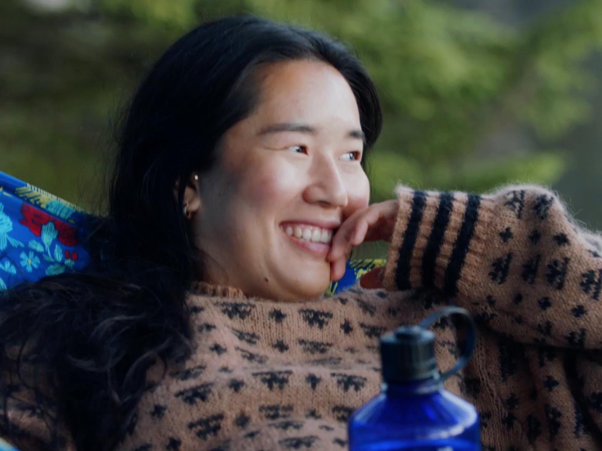 Girl resting in hammock, enjoying nature
