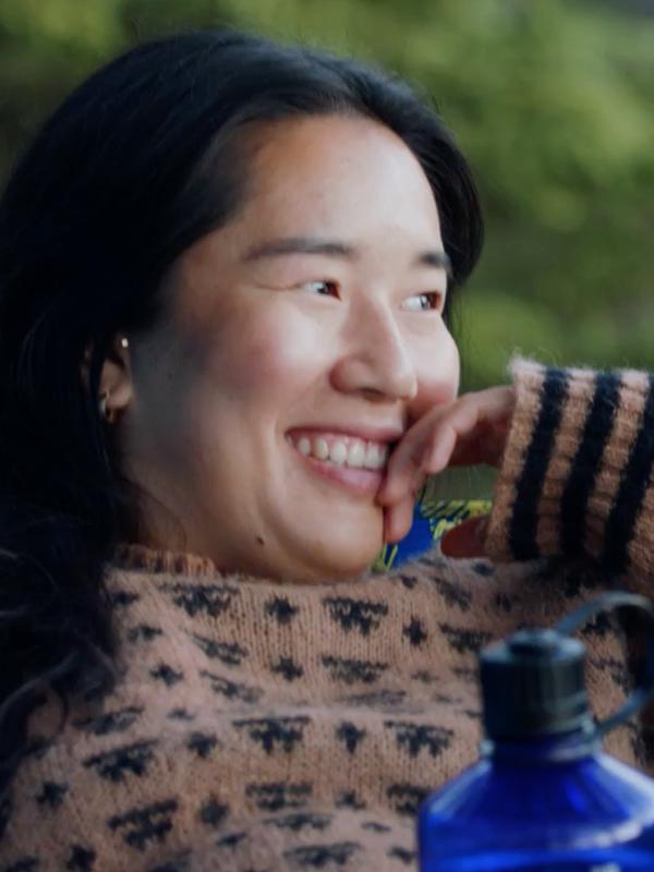 Girl resting in hammock, enjoying nature
