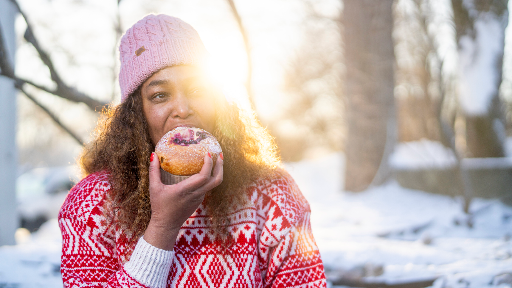 Woman eating bun at the Anne på Landet café, in Frognerparken