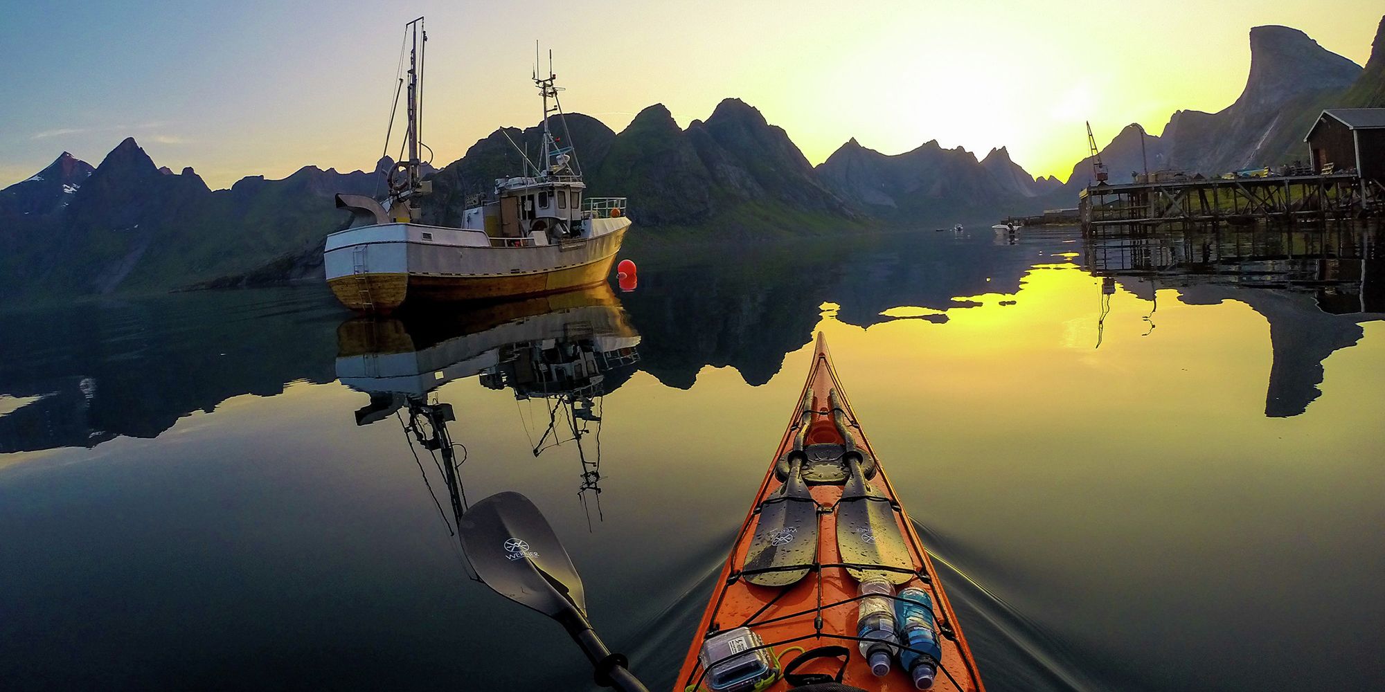 Kayaking into the midnight sun on Kjerkfjorden in Lofoten