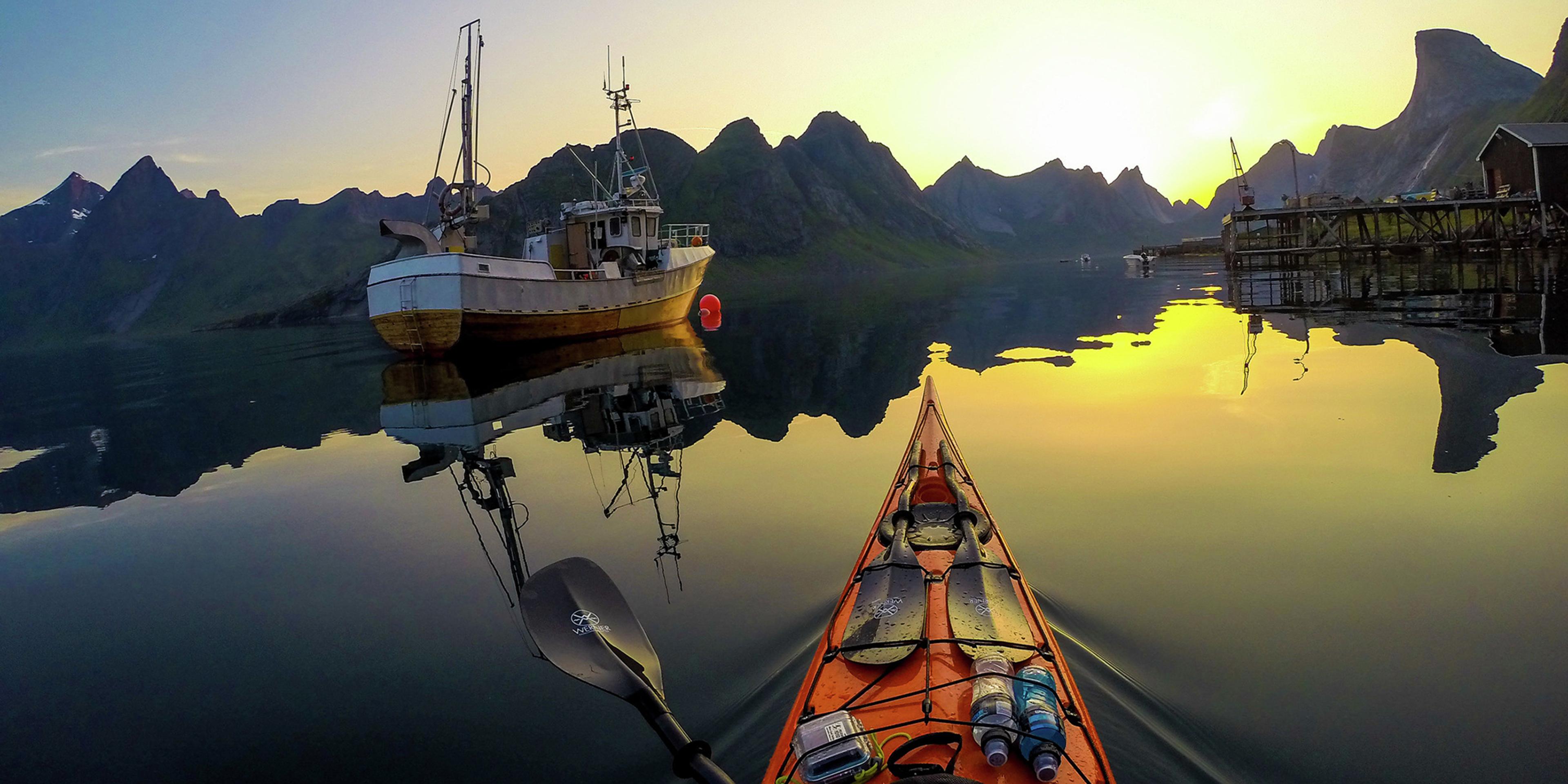 Kayaking into the midnight sun on Kjerkfjorden in Lofoten