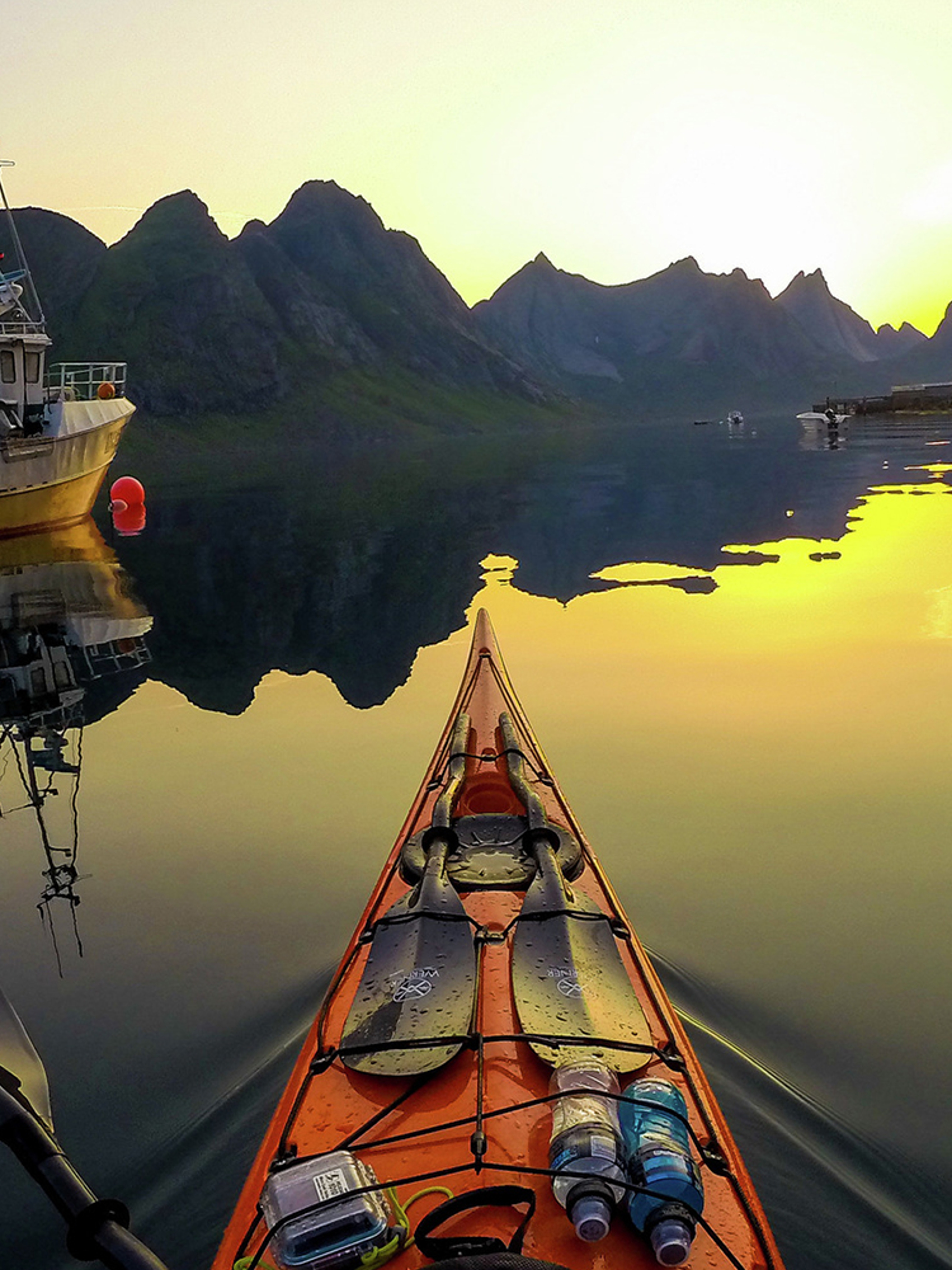 Kayaking into the midnight sun on Kjerkfjorden in Lofoten