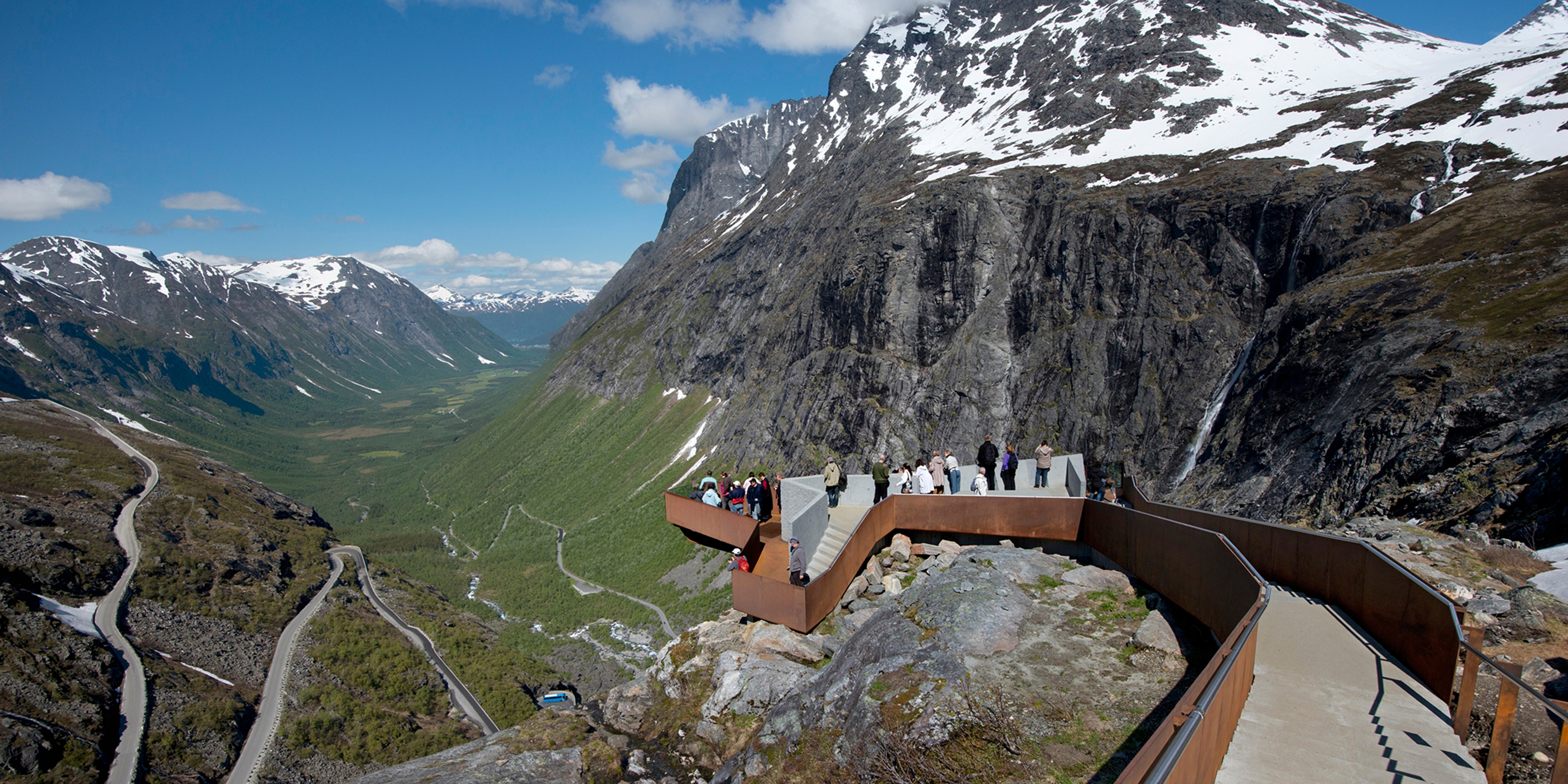 Places to go in Norway: People on a viewing platform above National Scenic Route Trollstigen in Fjord Norway