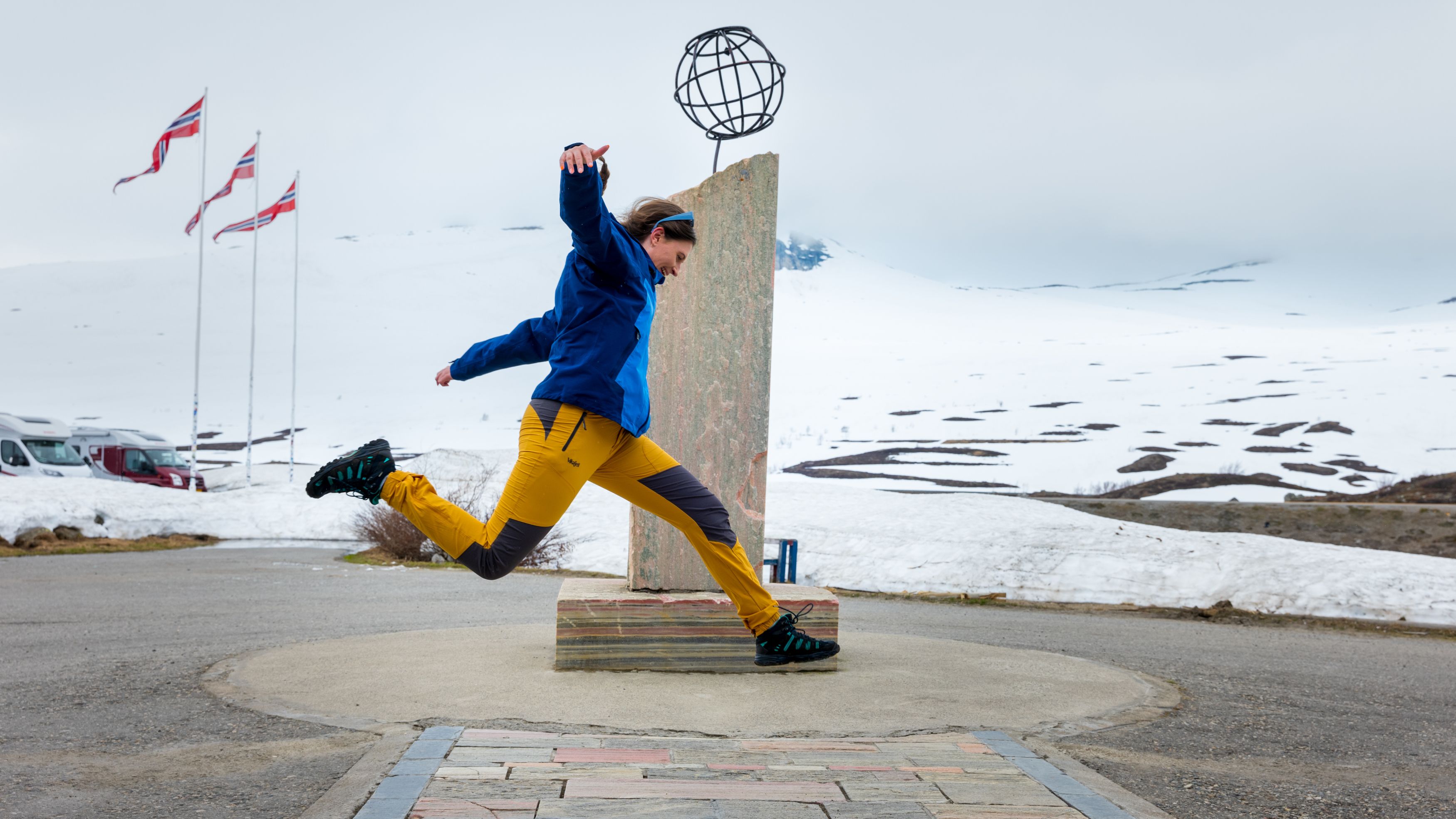 Girl crossing the Arctic circle at Saltfjellet mountain, Northern Norway.