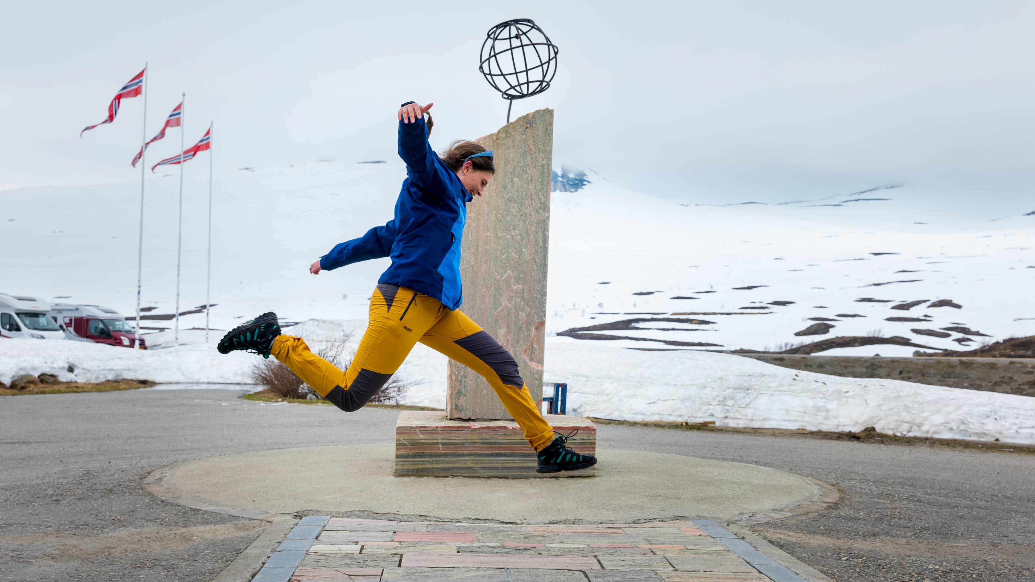 Girl crossing the Arctic circle at Saltfjellet mountain, Northern Norway.
