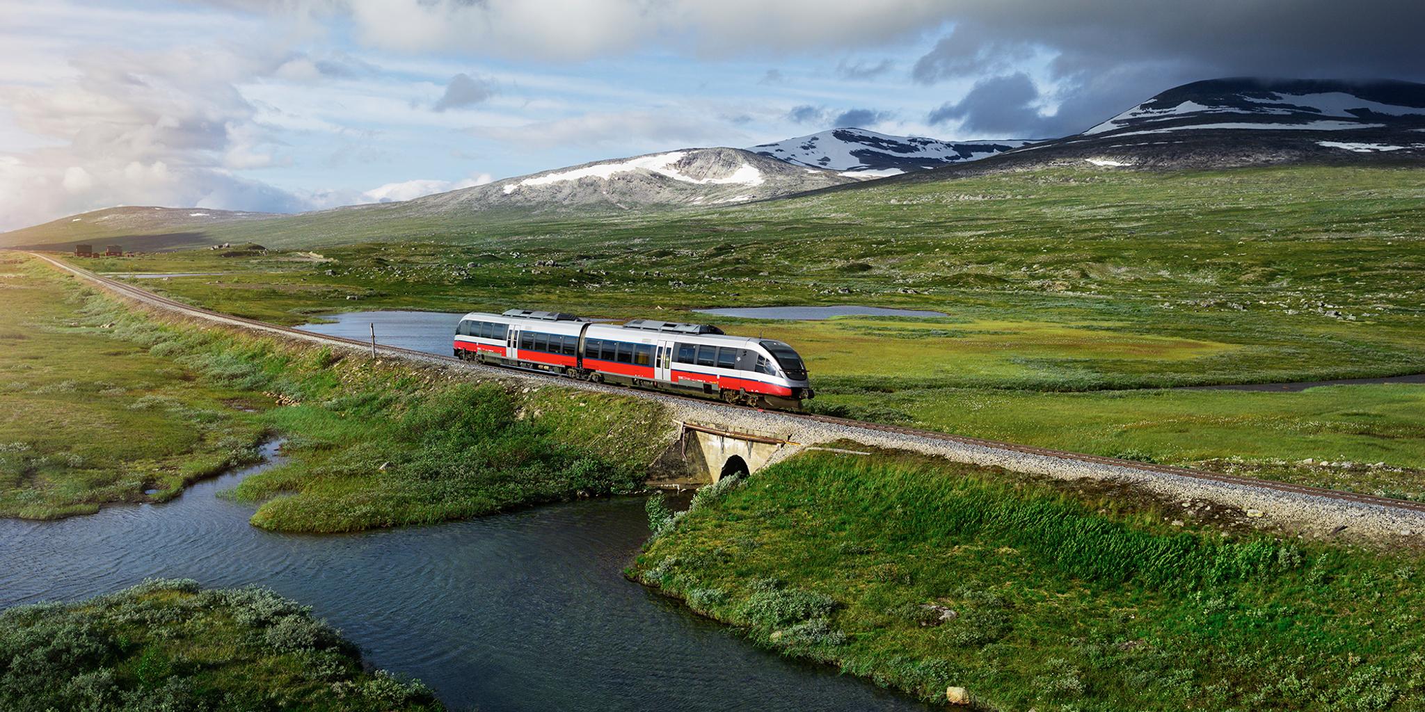 A train passing by a lake in Saltfjellet mountain area in Nordland