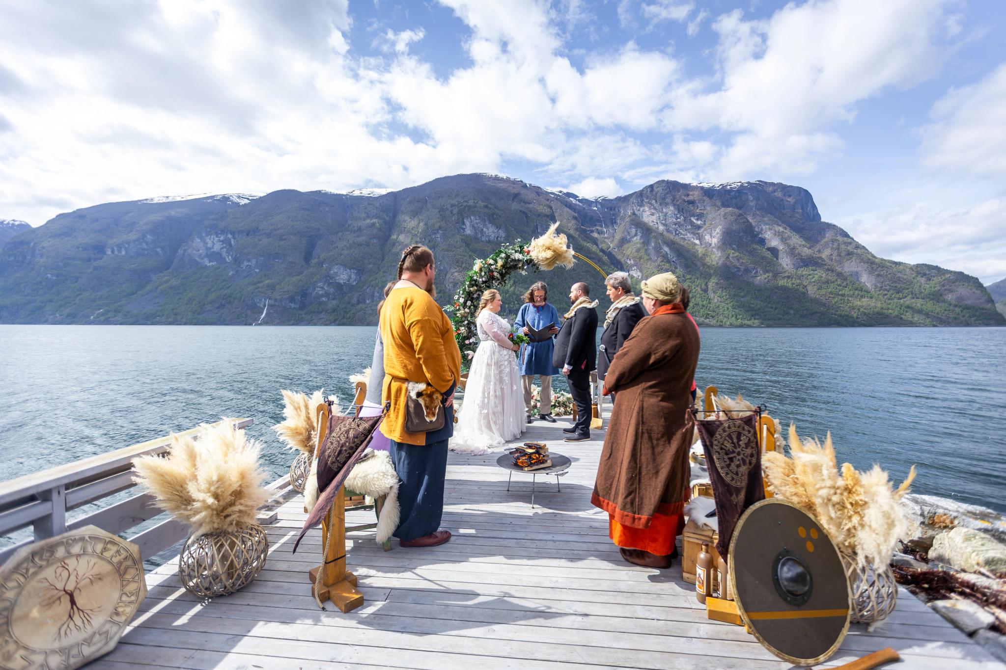 A couple saying yes to each other in a viking theme wedding by the Aurlandsfjord in Fjord Norway