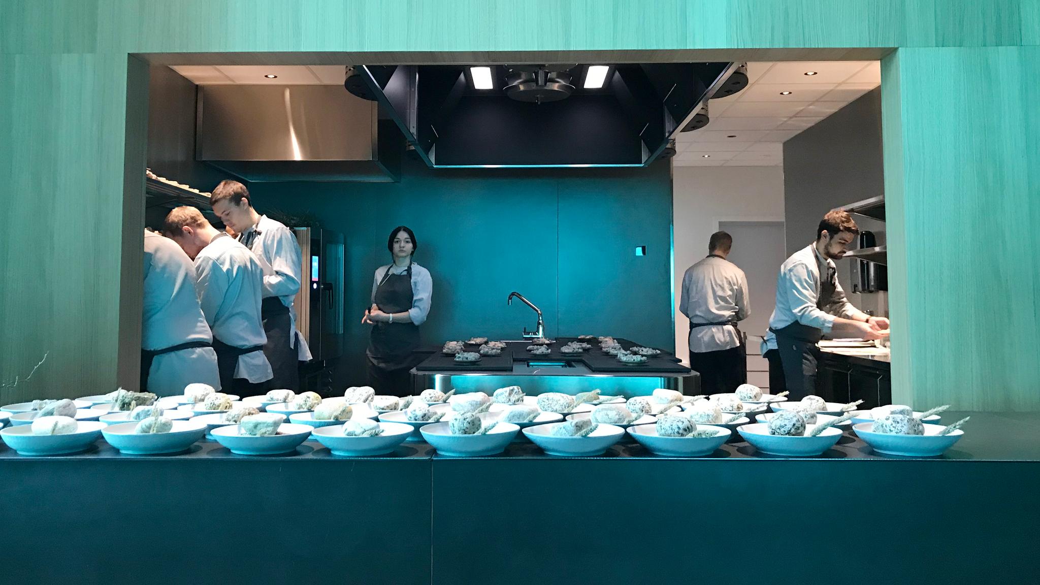 View of the kitchen and meal preparations in the underwater restaurant Under in Lindesnes, Southern Norway