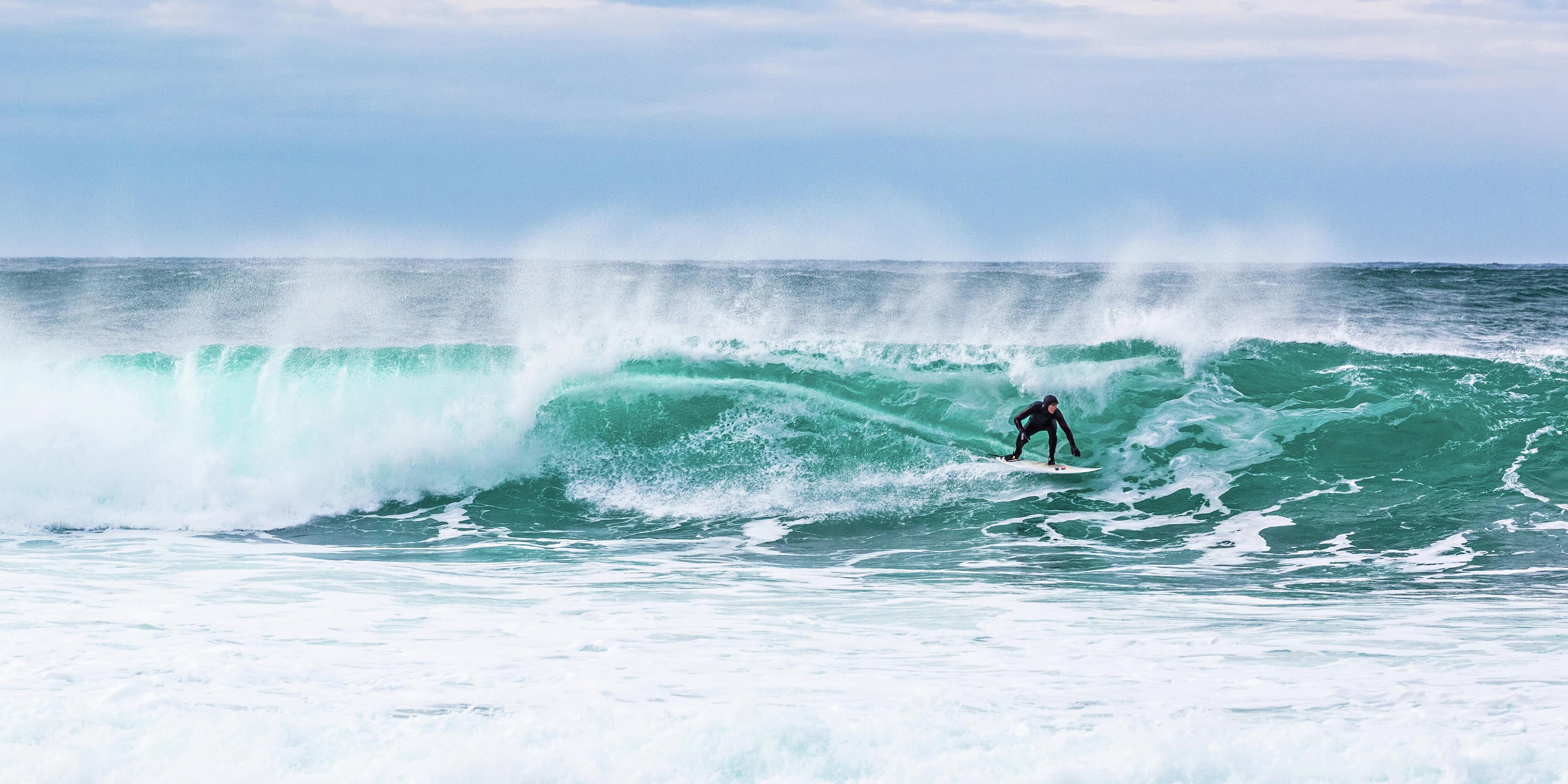 Surfer at Unstad in Lofoten, Northern Norway
