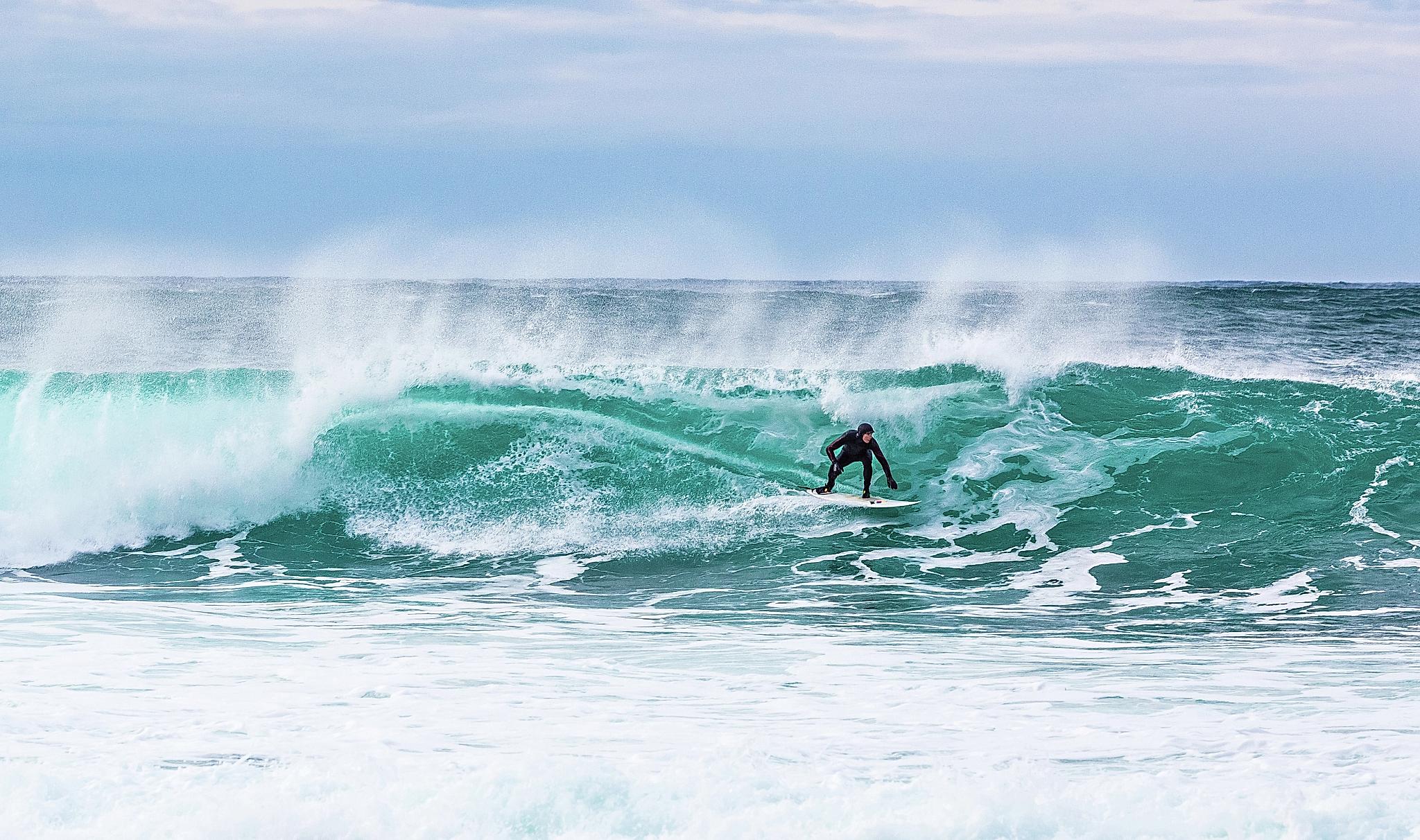 Surfer at Unstad in Lofoten, Northern Norway