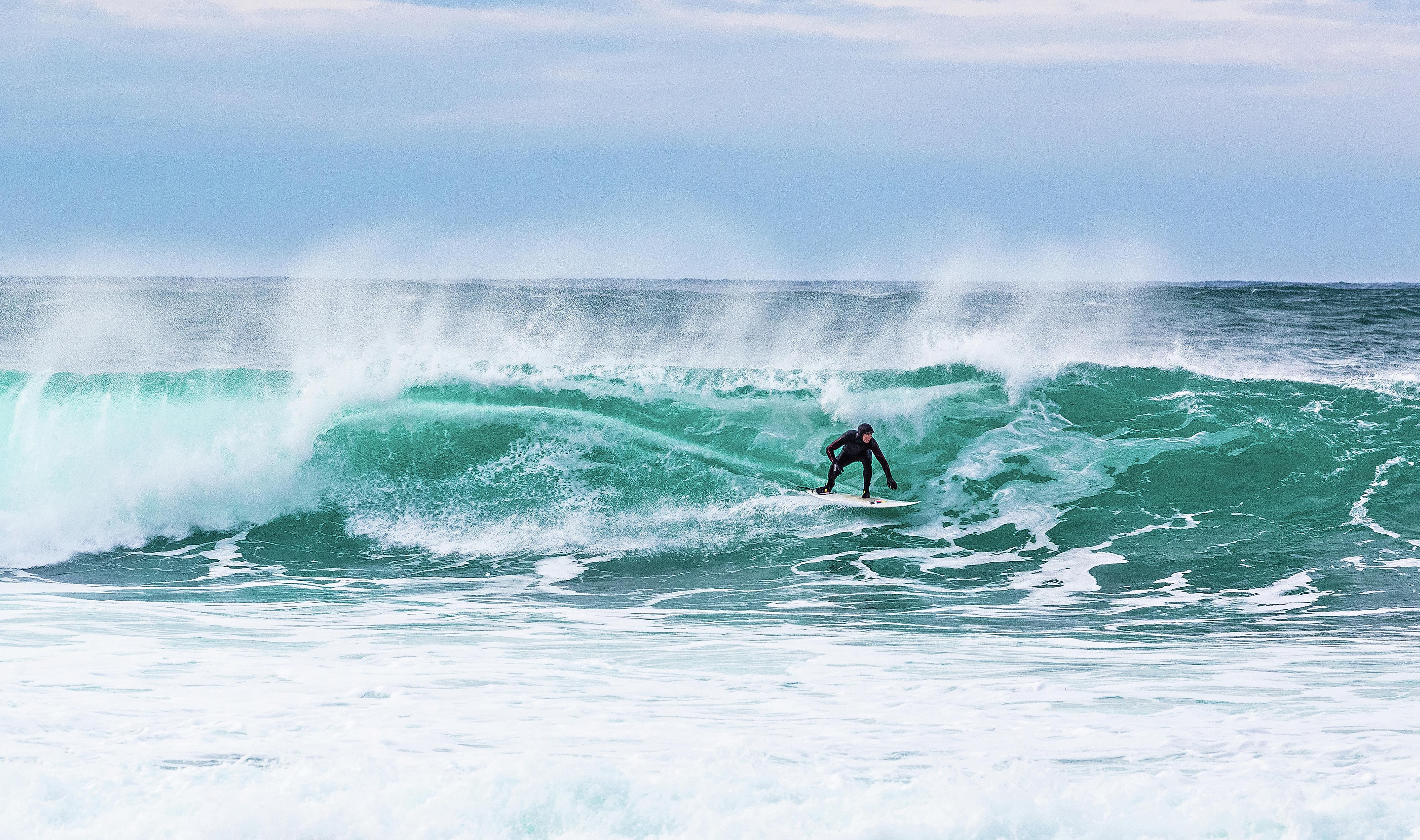 Surfer at Unstad in Lofoten, Northern Norway