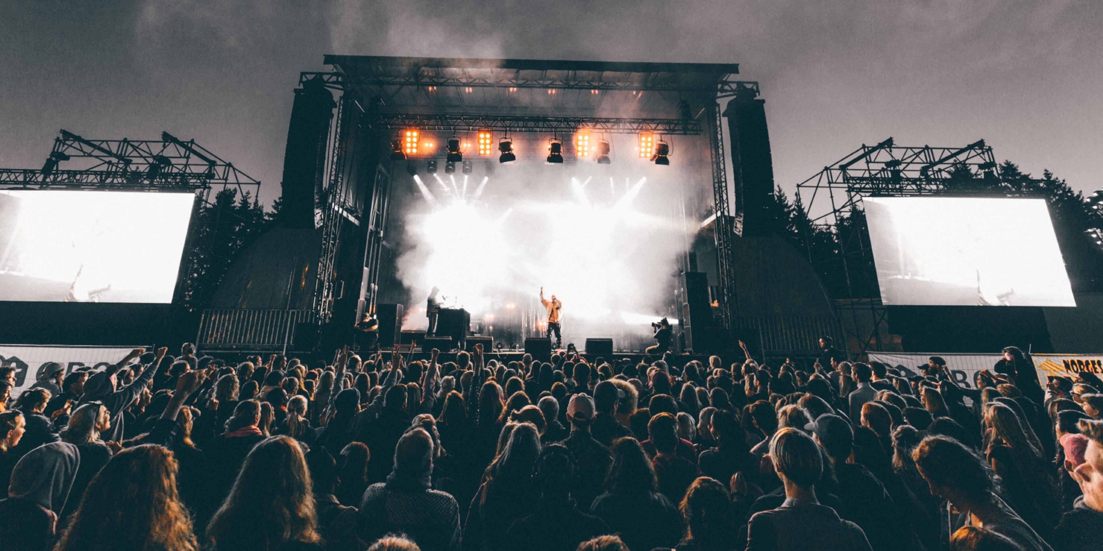 A band performing in front of a big audience at Granittrock festival in Oslo