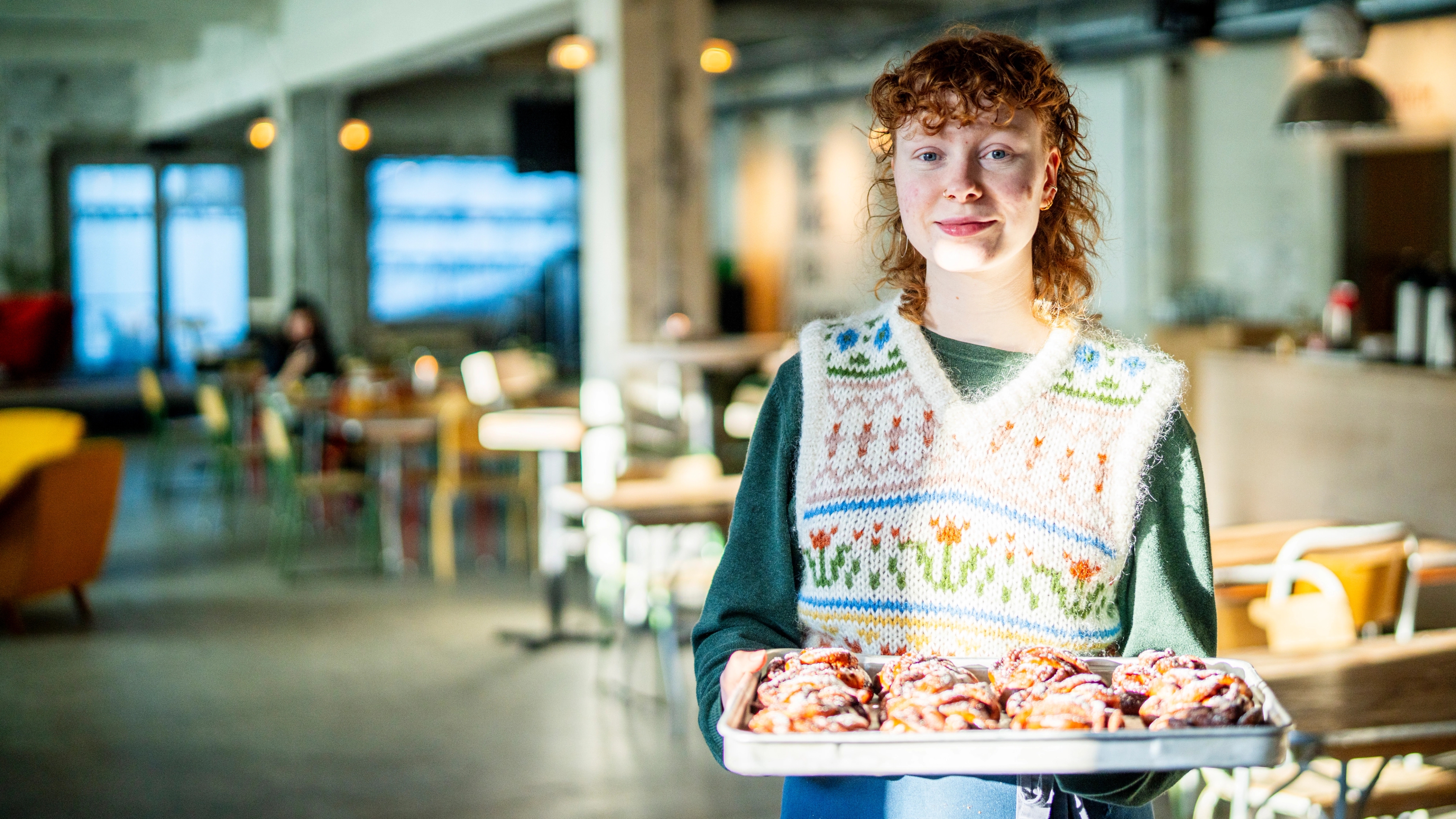 Woman with cinnamon buns