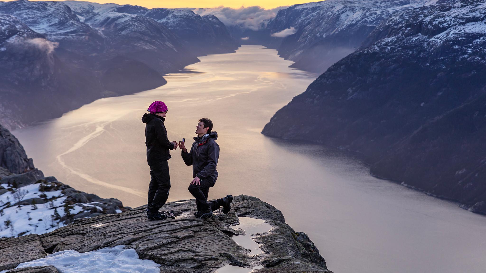 Man proposing to woman at Preikestolen mountain