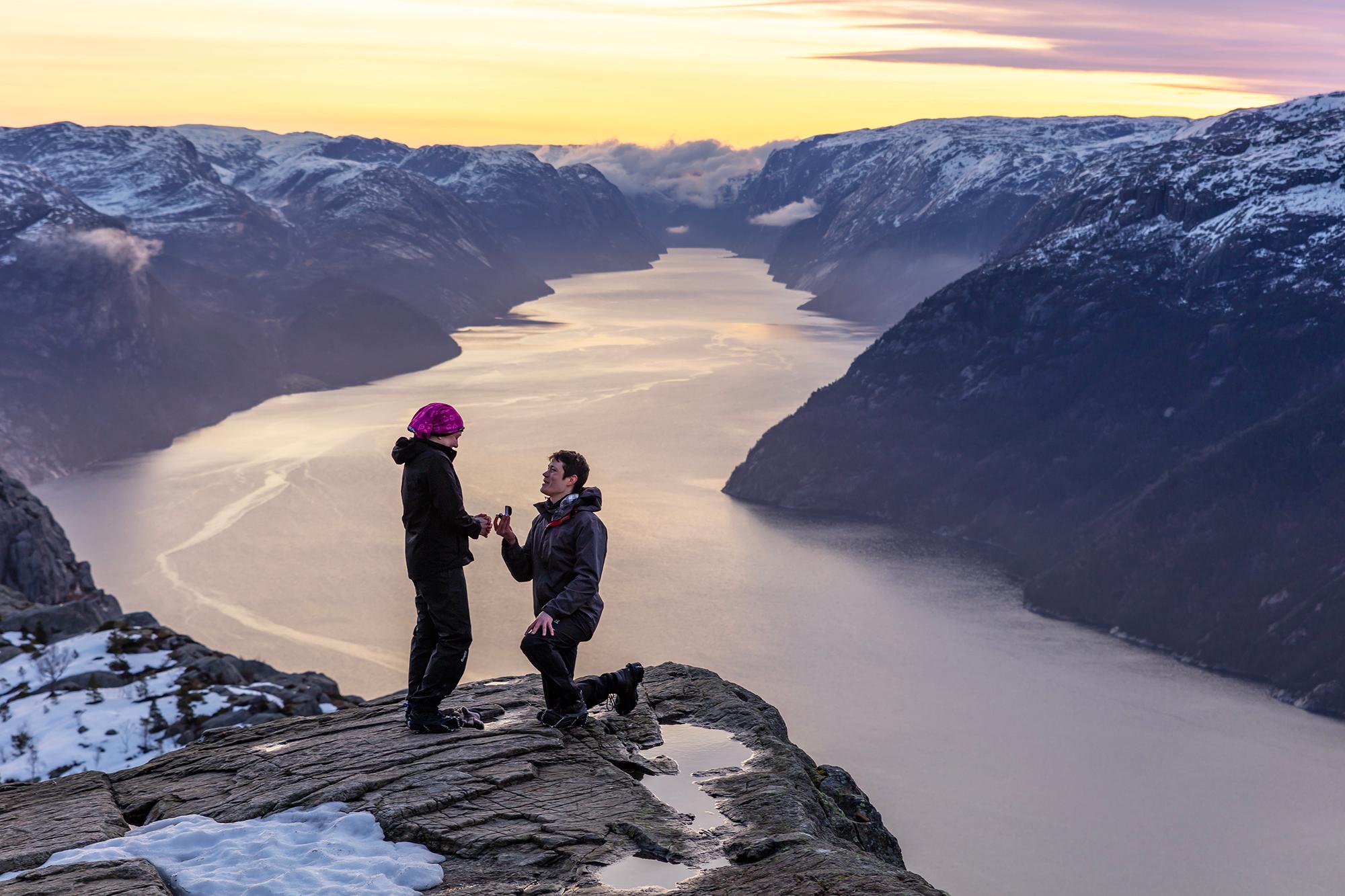 Man proposing to woman at Preikestolen mountain