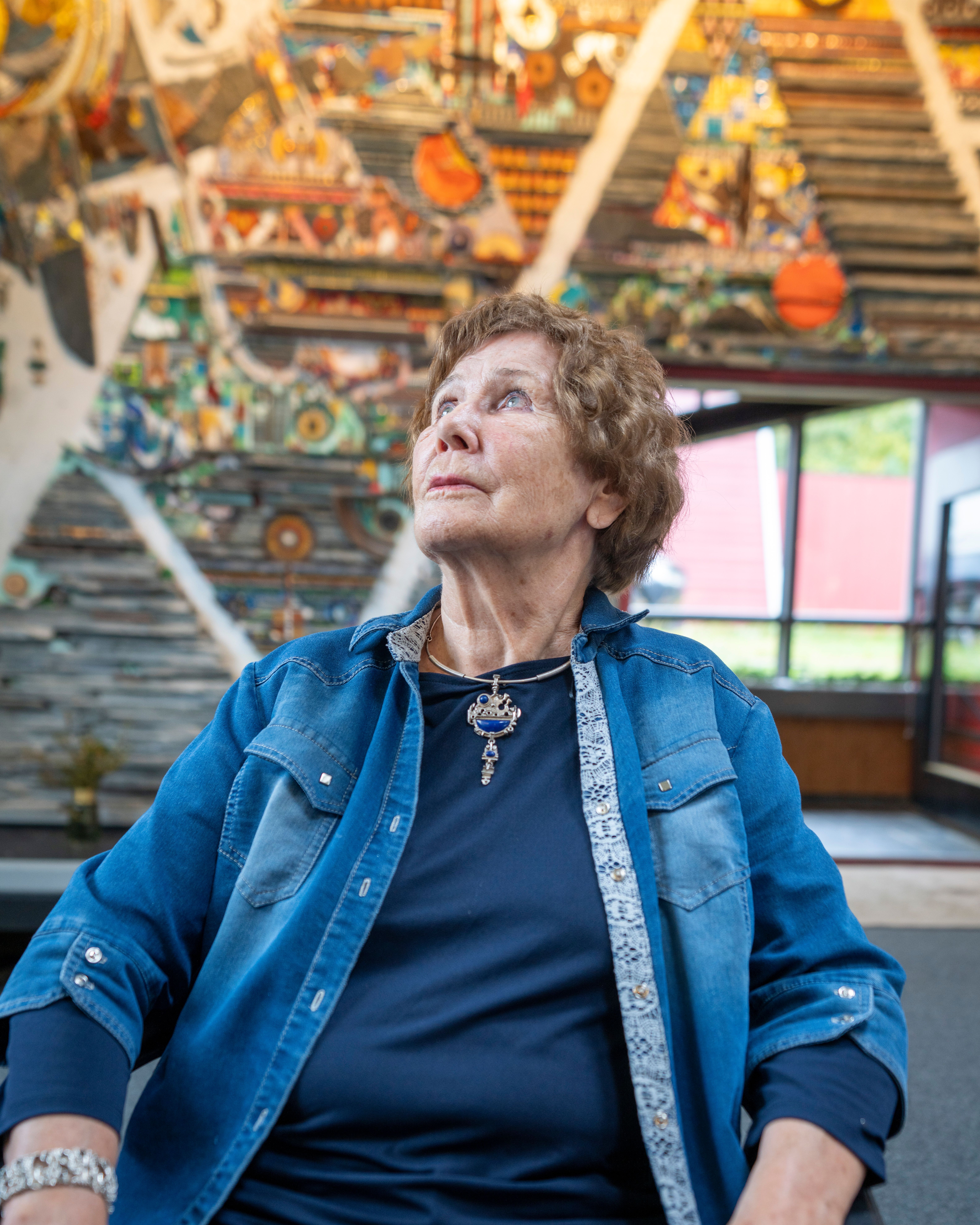 Regine Juhls in front of her mosaic at Juhls Silver Gallery