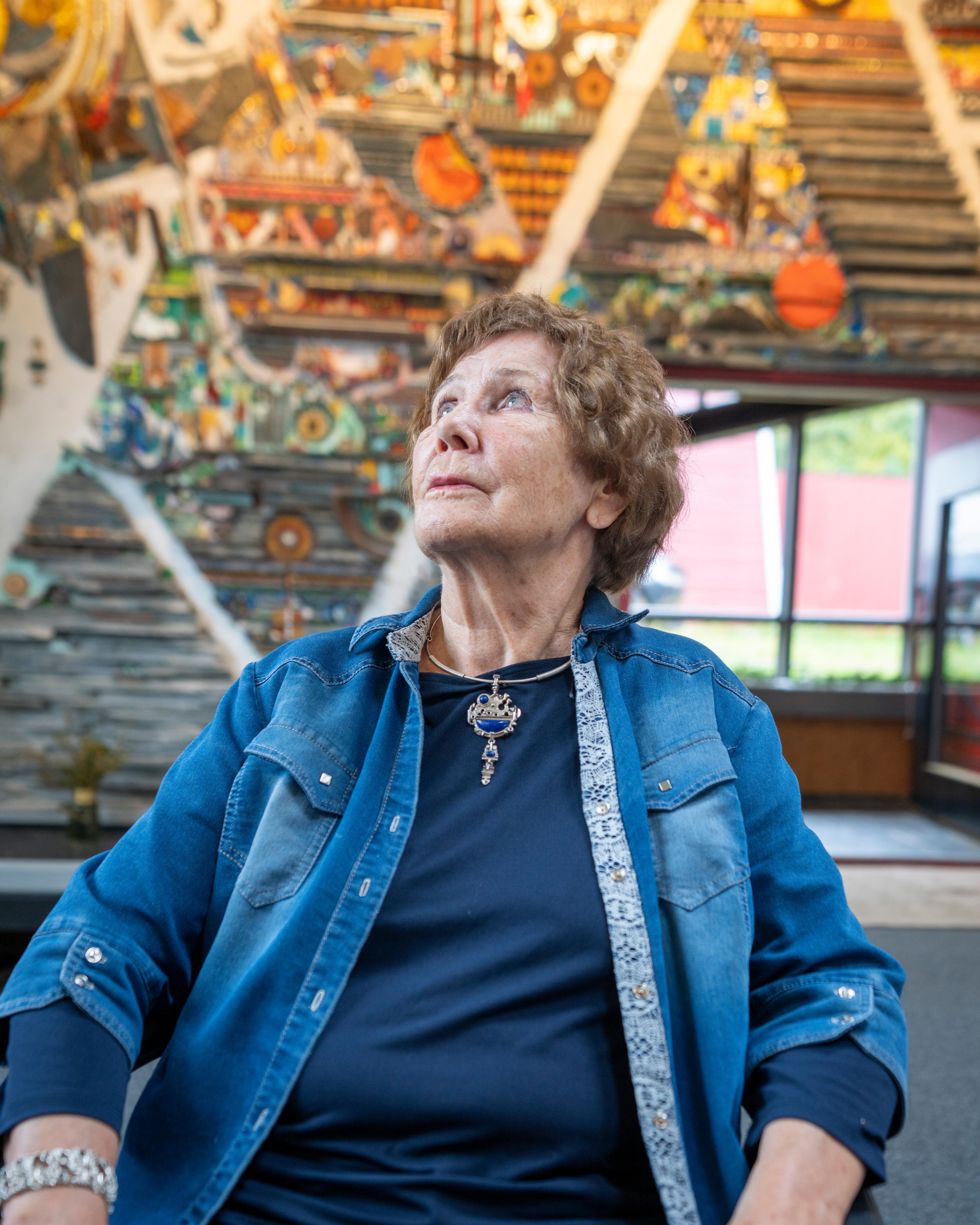 Regine Juhls in front of her mosaic at Juhls Silver Gallery