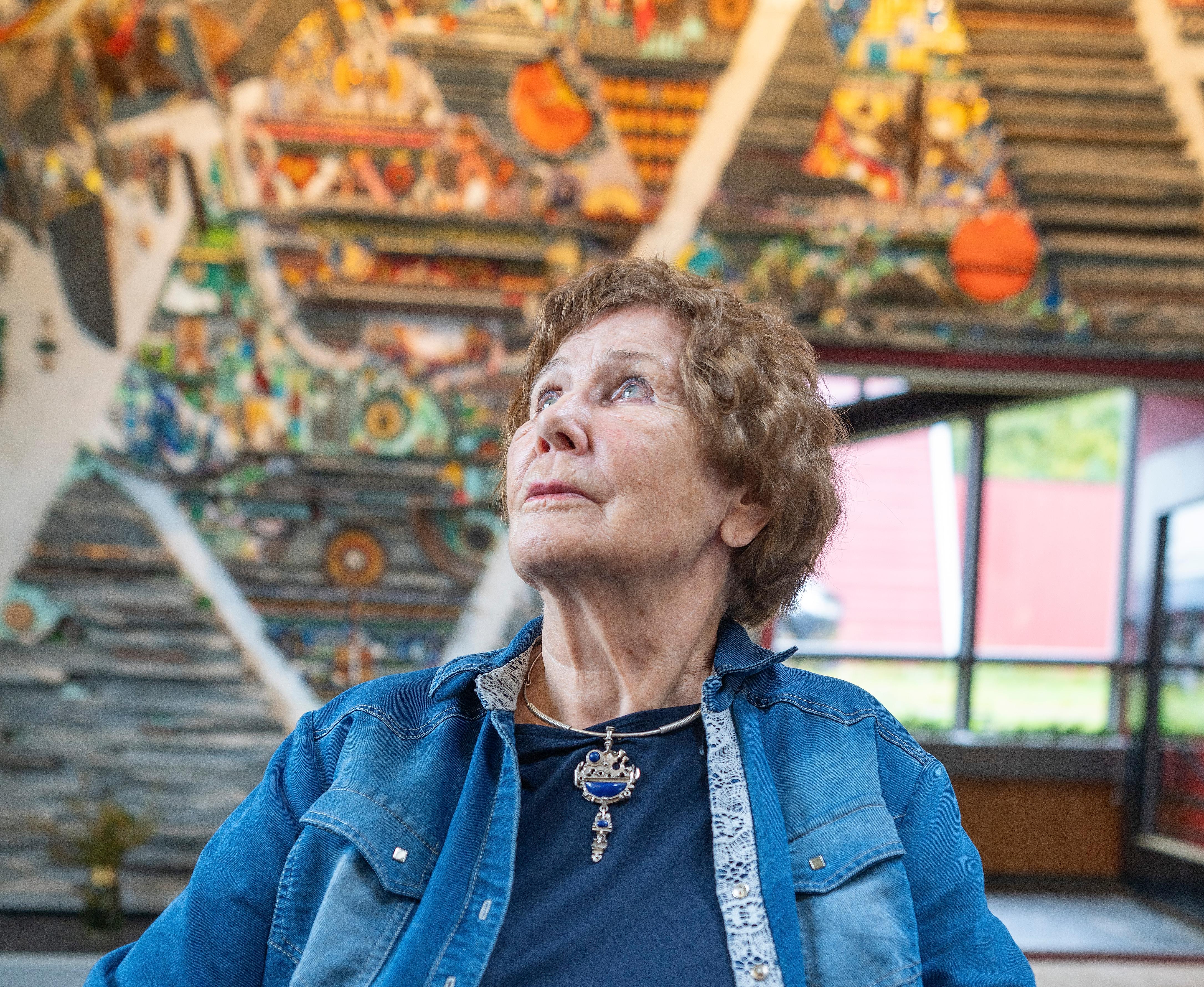 Regine Juhls in front of her mosaic at Juhls Silver Gallery