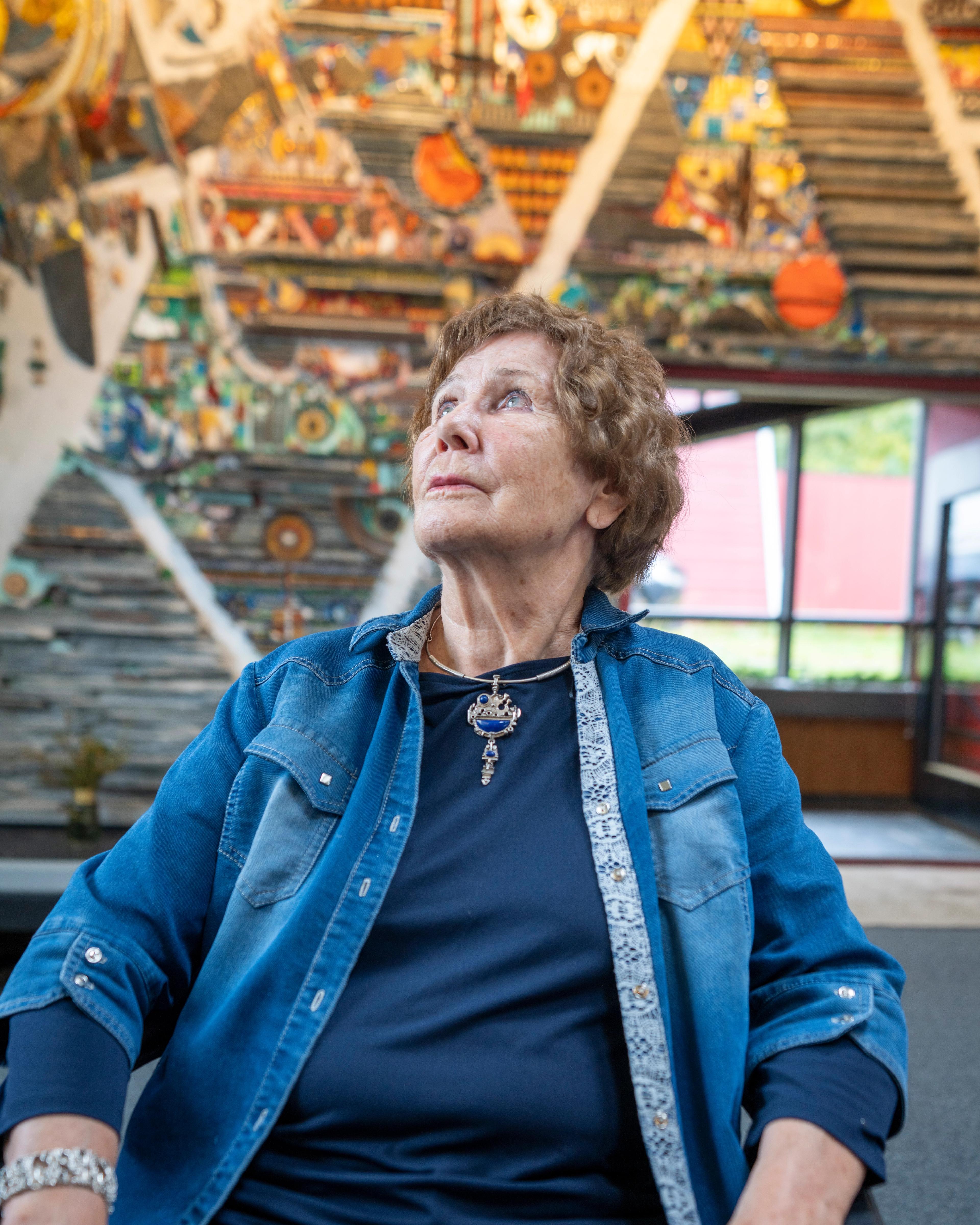 Regine Juhls in front of her mosaic at Juhls Silver Gallery