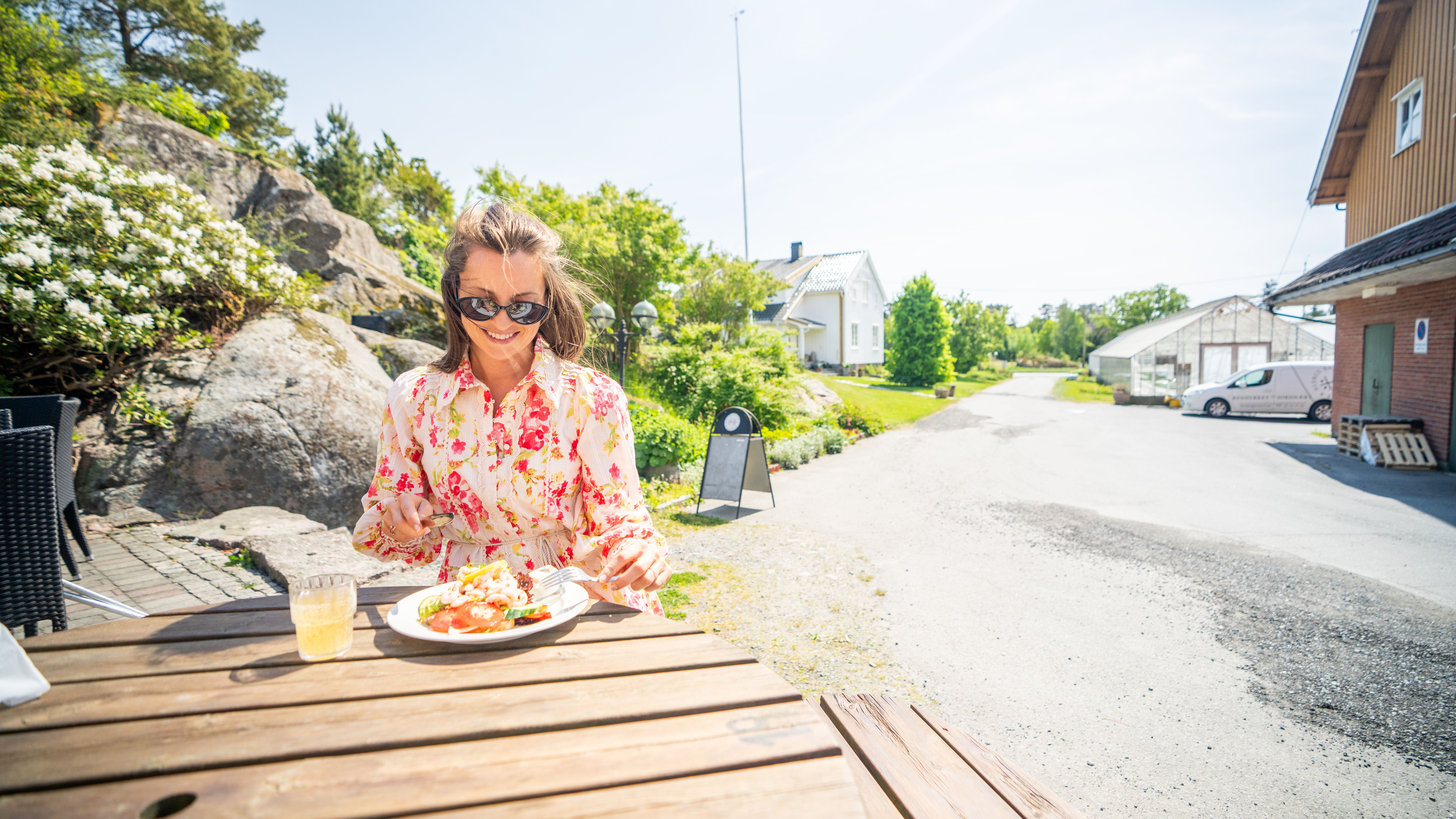 Girl enjoying a meal at Hesnes Gartneri, just outside Grimstad, Southern Norway