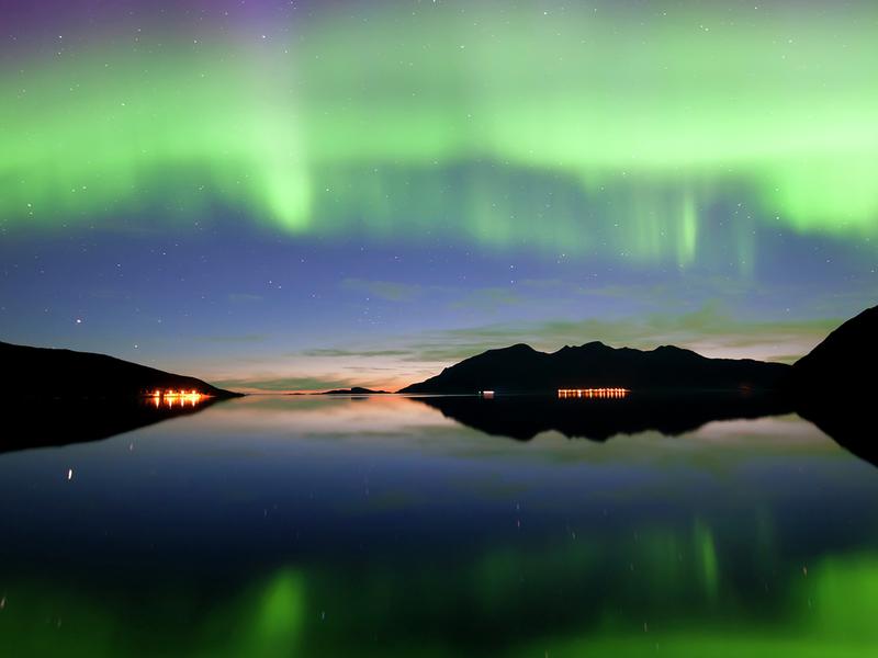Northern lights over Grøtfjord in Kvaløya, Northern Norway
