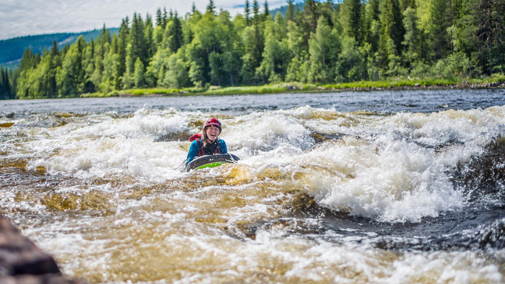 Riverboarding down the river in Trysil, Eastern Norway