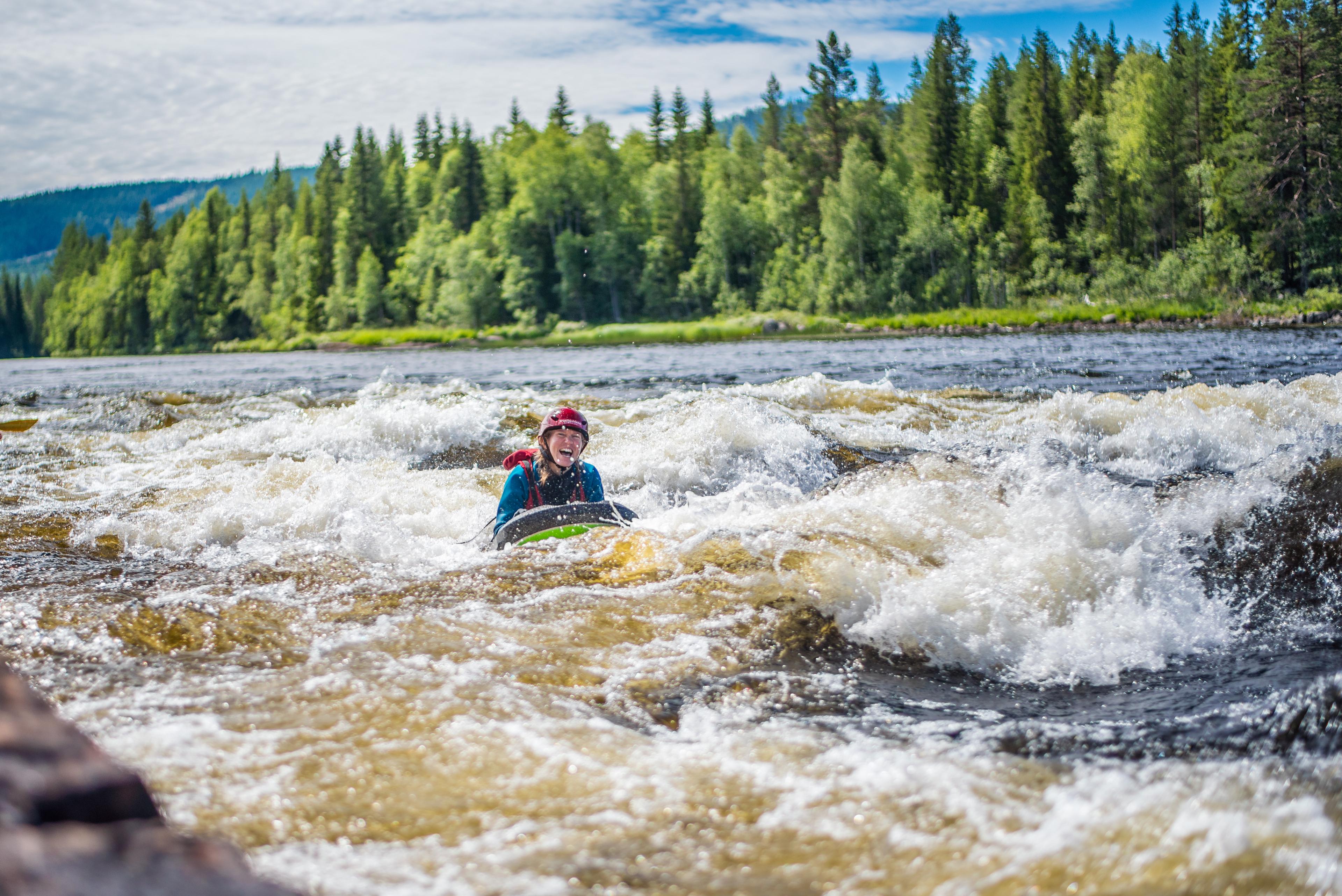Riverboarding down the river in Trysil, Eastern Norway