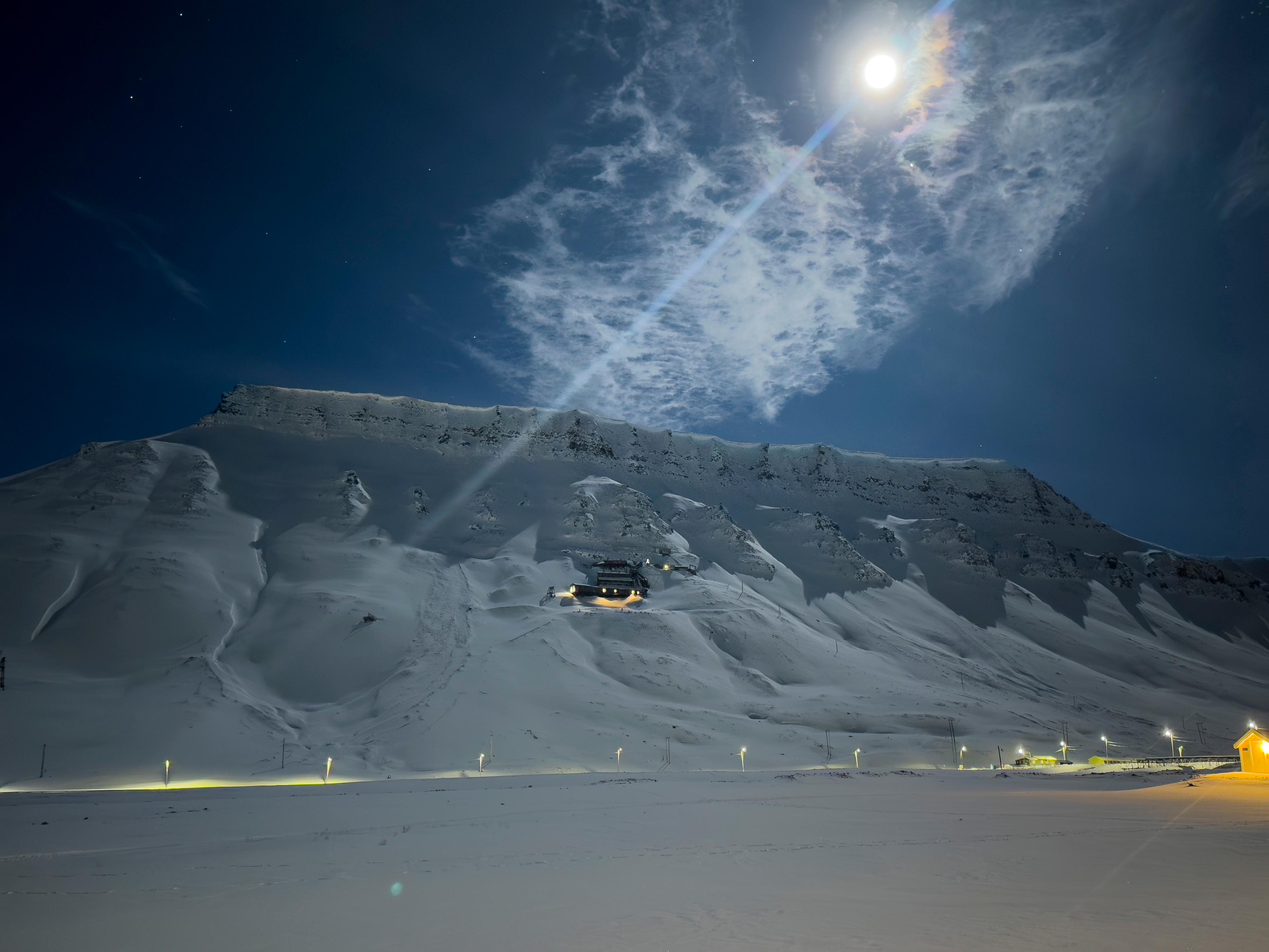 A house and a mine between white mountains