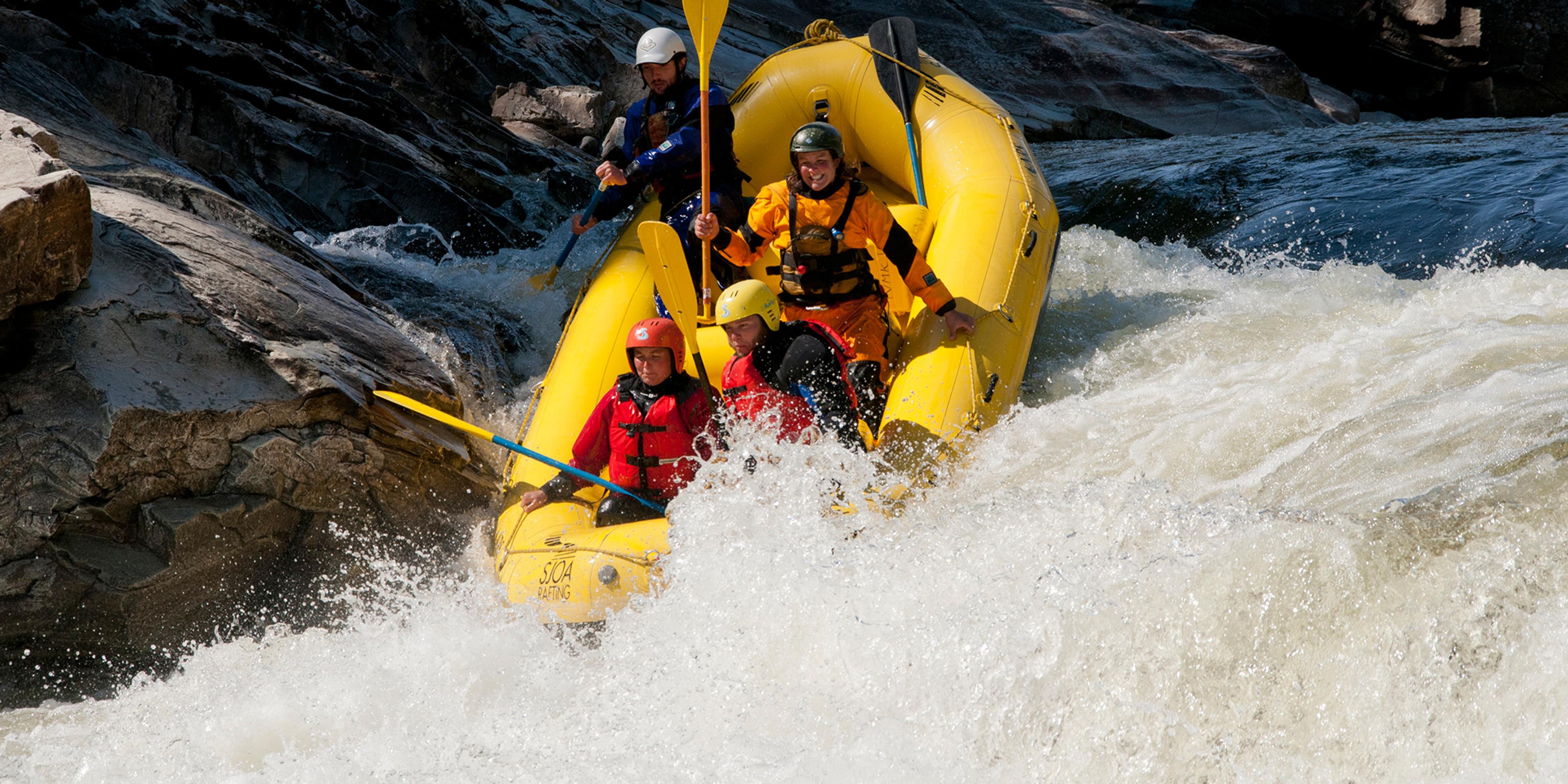 Four people rafting down the Sjoa river in Eastern Norway