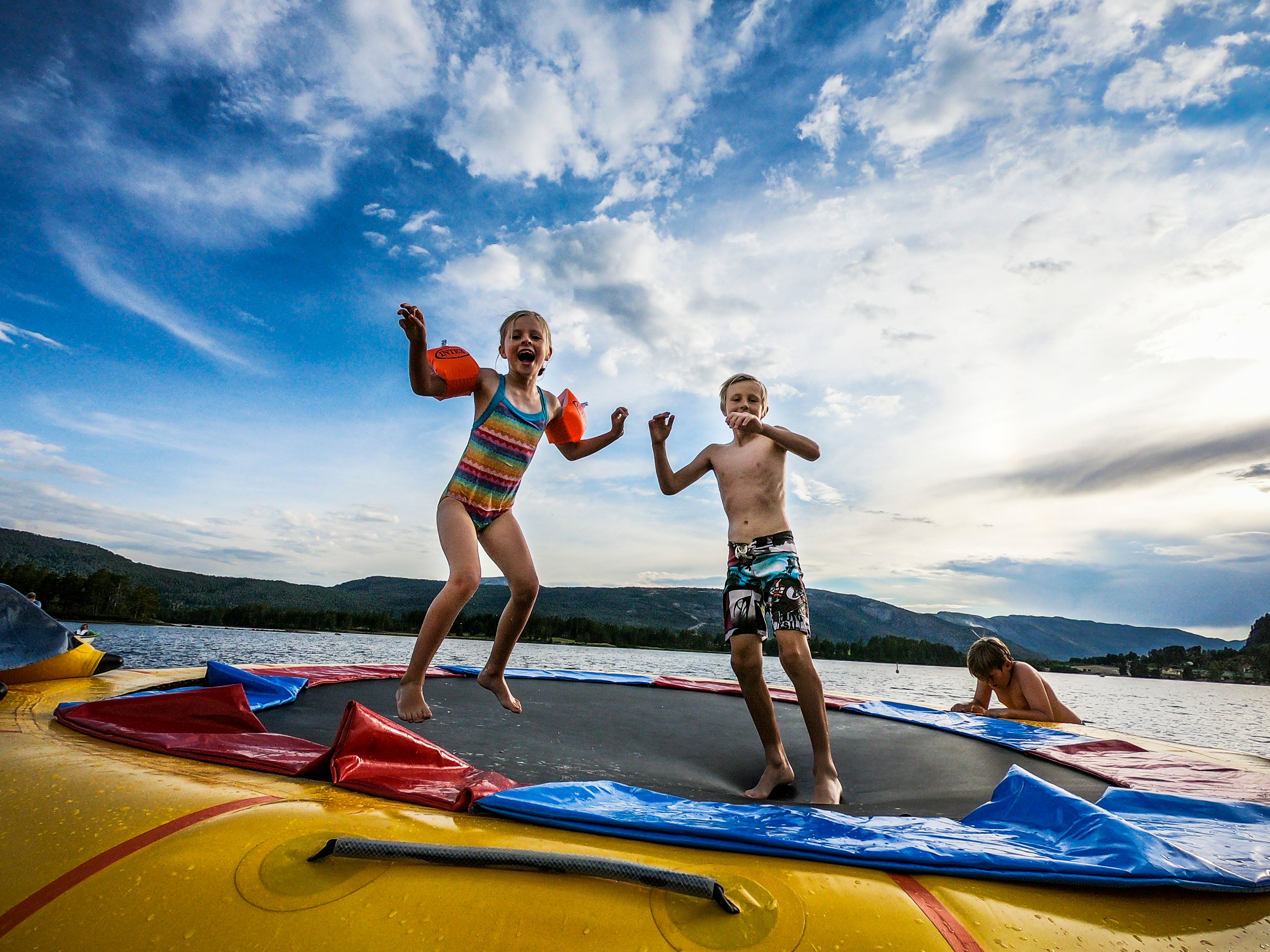 Kids playing in the water by Vrådal in Eastern Norway